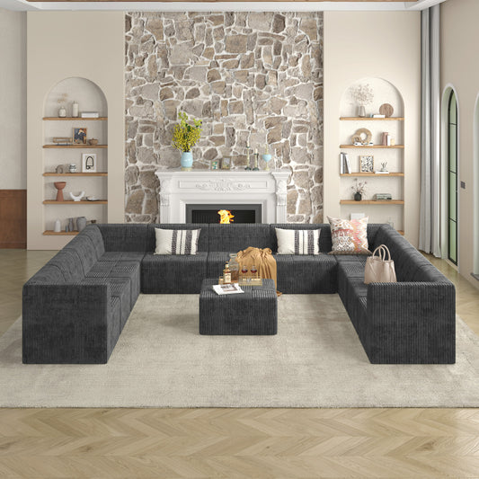 Dark gray corduroy sectional sofa with plush seating and a central ottoman perfect for a modern living room