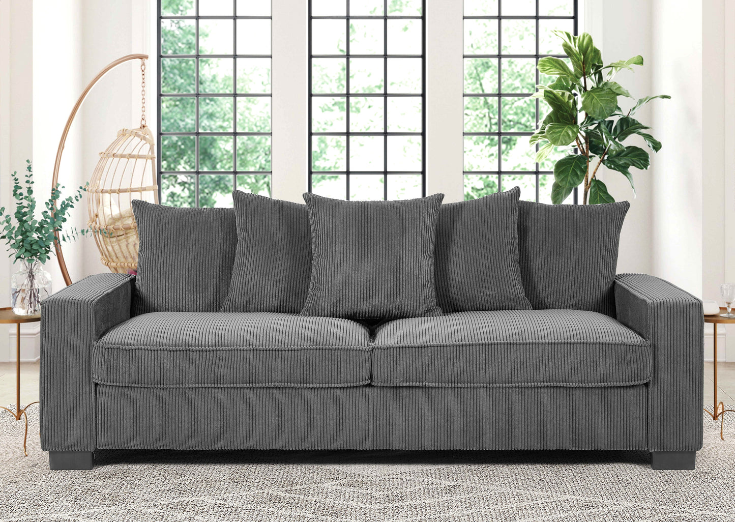 Modern gray corduroy sofa with plush throw pillows perfect for a cozy living room