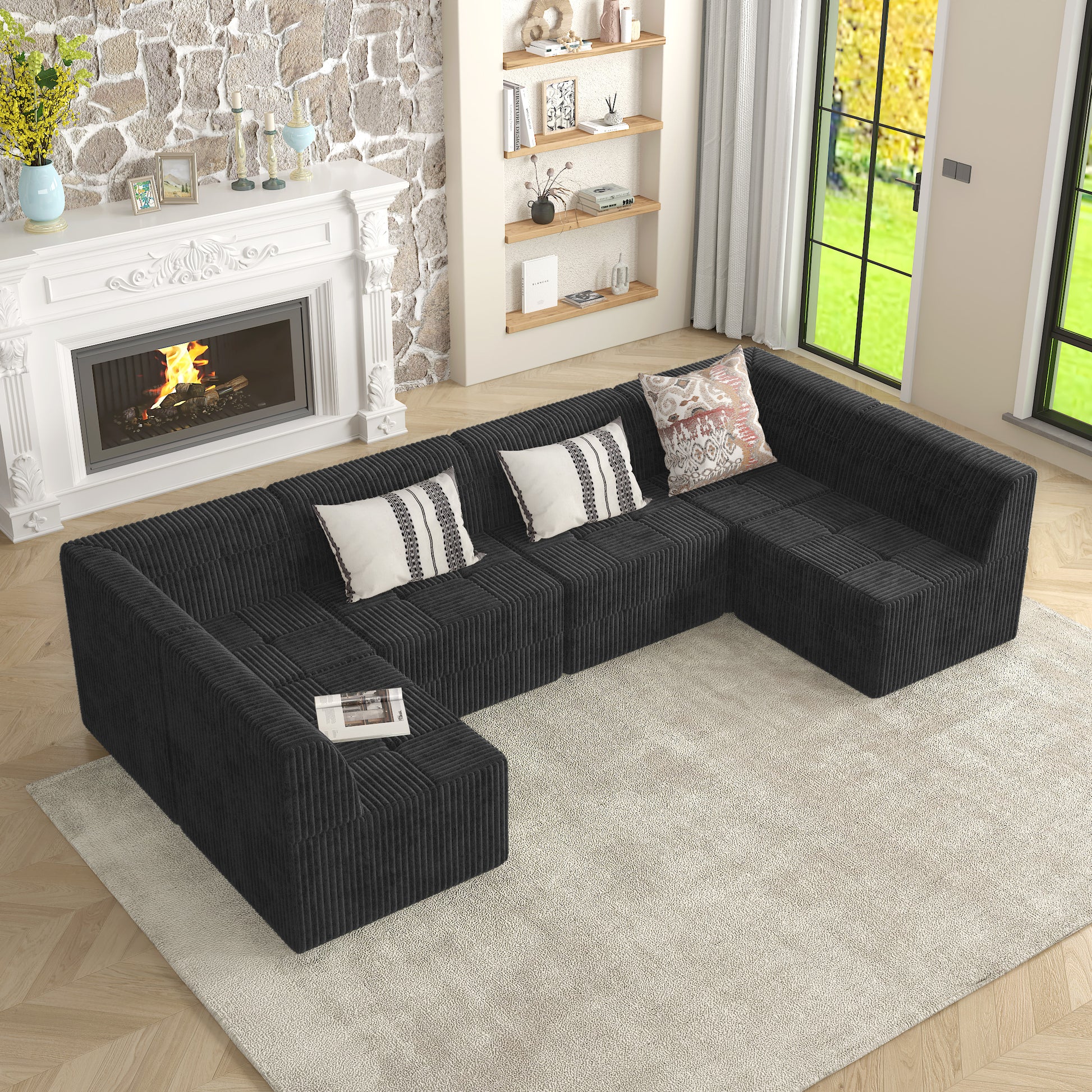 Dark gray corduroy sectional sofa with modular cubic seating and neutral throw pillows
