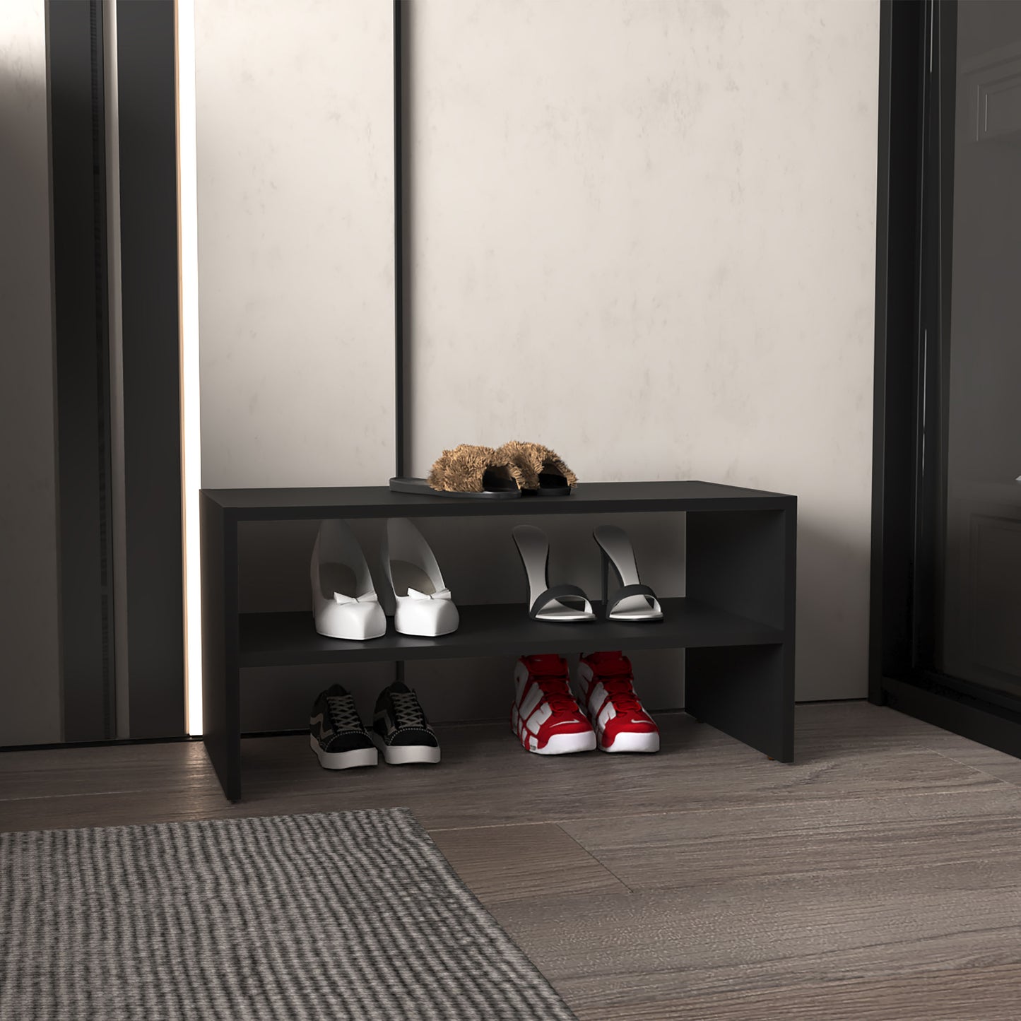 Stylish black shoe rack holding white heels black sandals and red sneakers