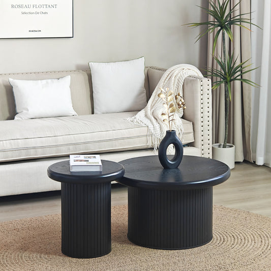 Round black wood nesting coffee tables with fluted bases