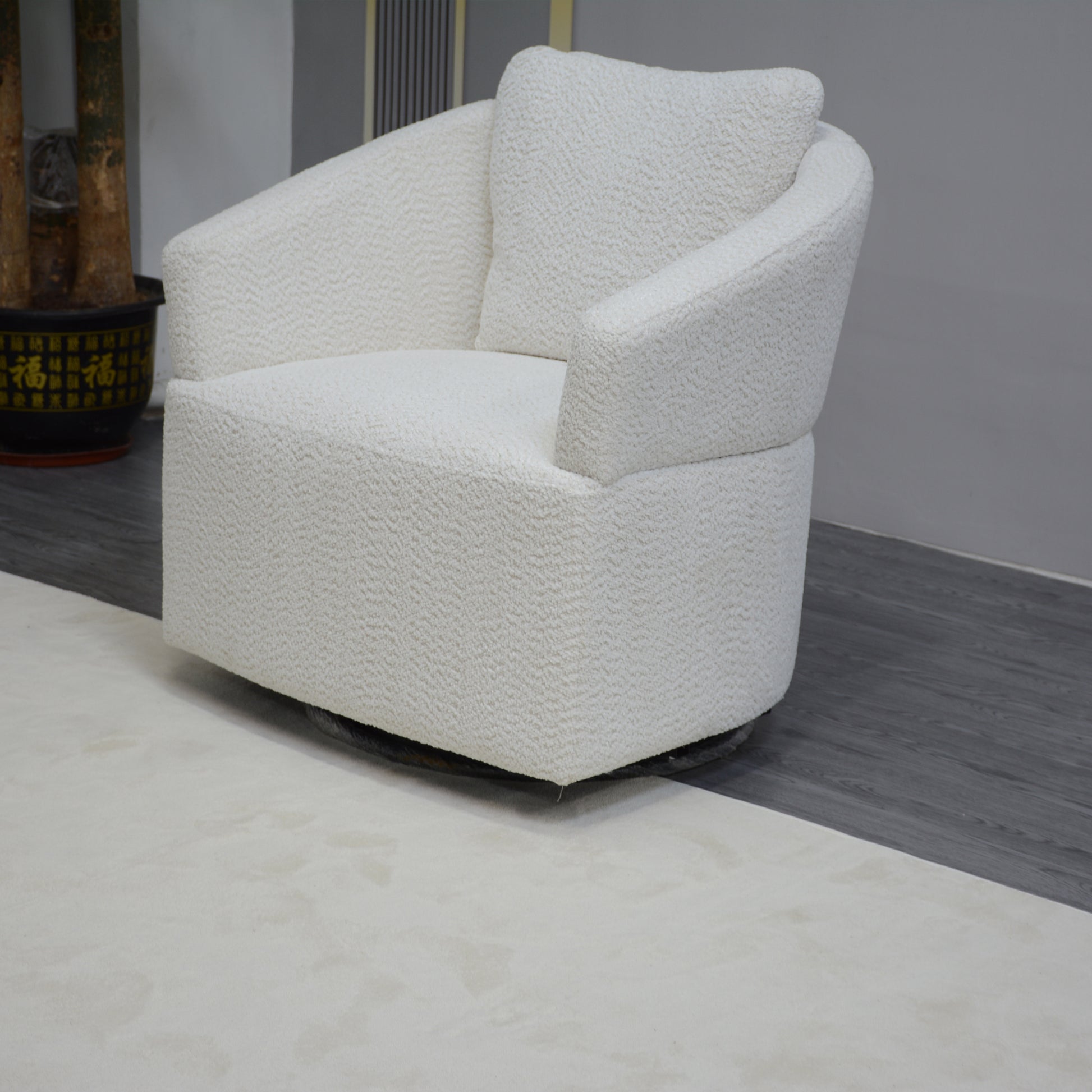 Plush white boucle accent chair with rounded arms and comfortable back pillow