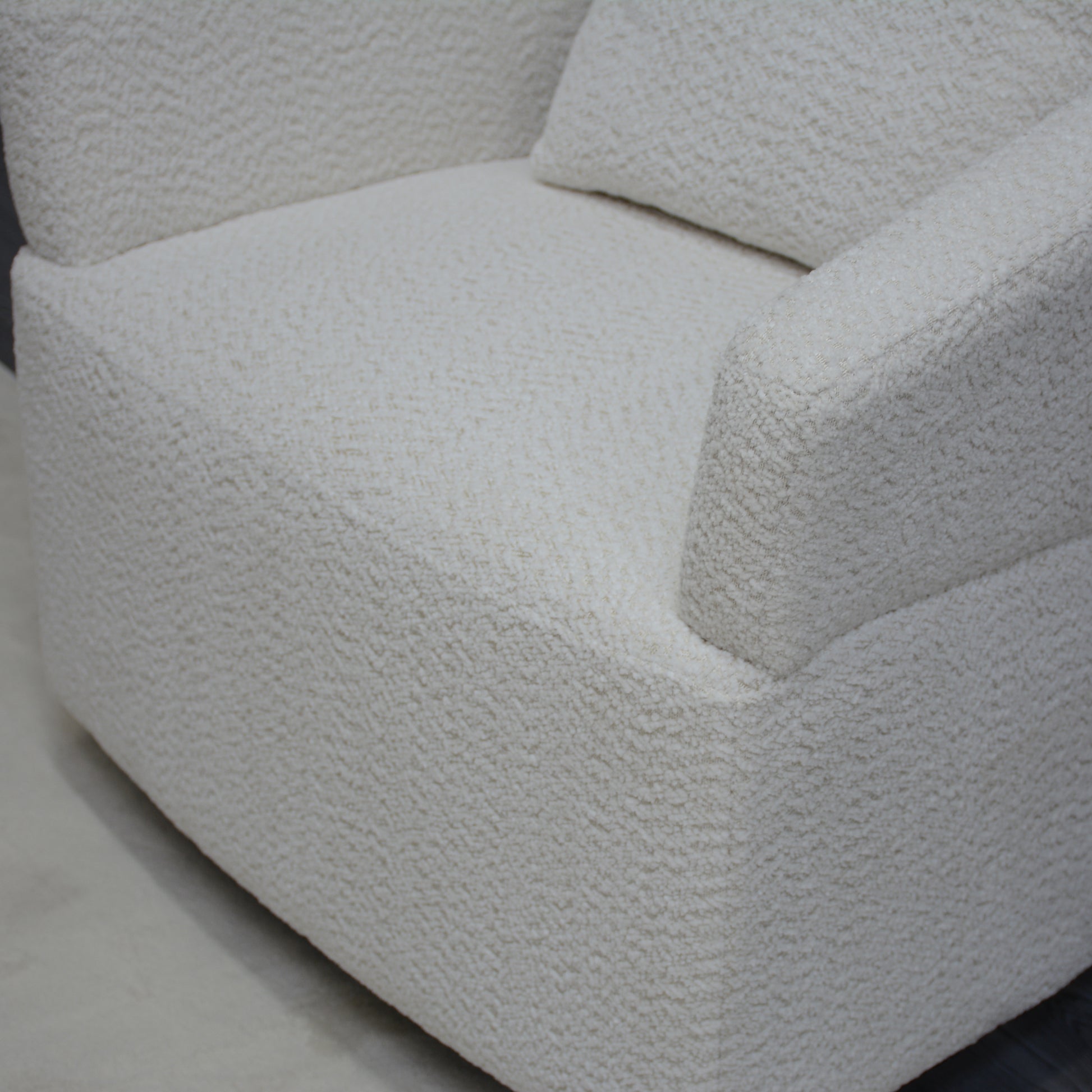 Cream boucle armchair with plush textured fabric perfect for cozy living rooms