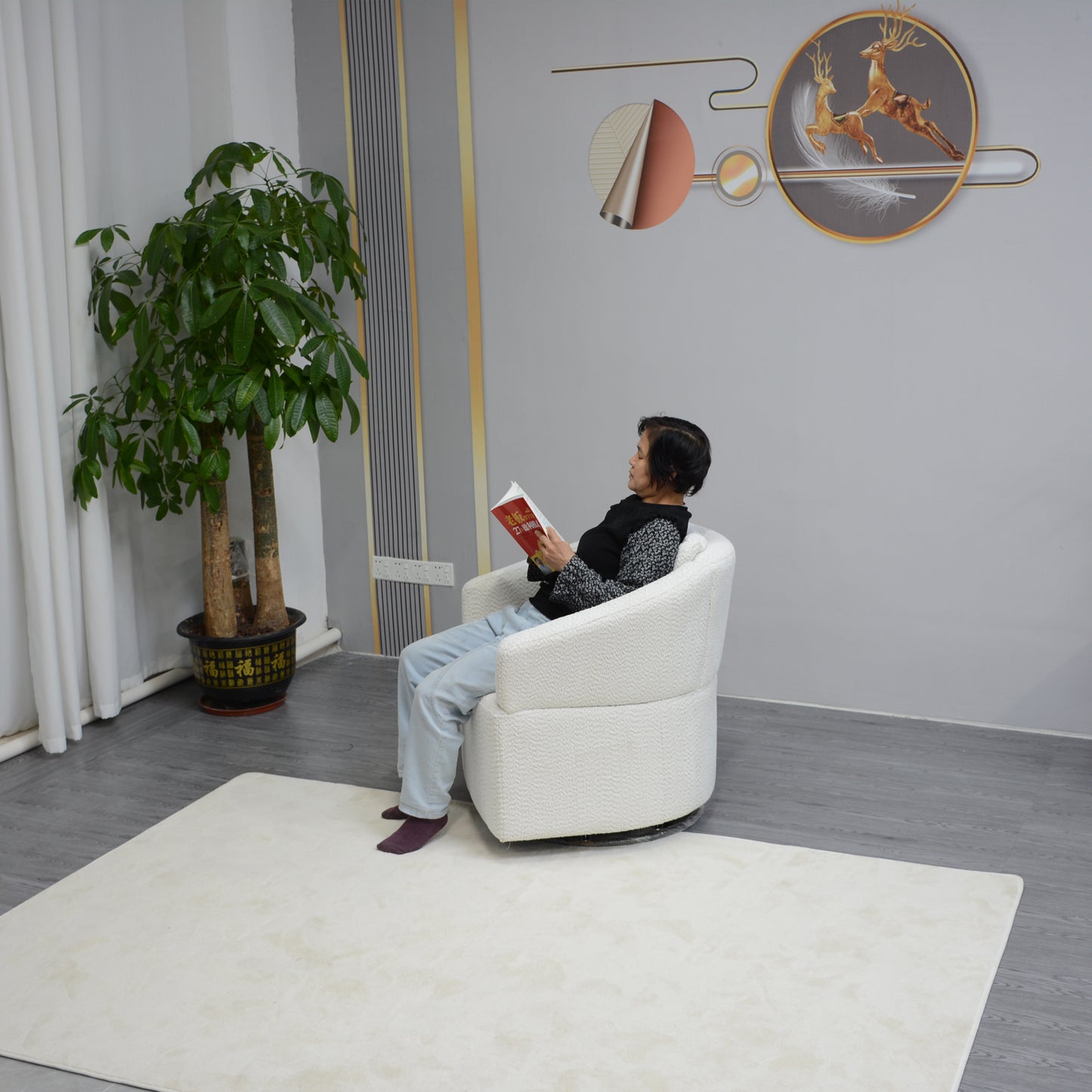 Cozy white boucle swivel accent chair with a textured finish perfect for a reading nook