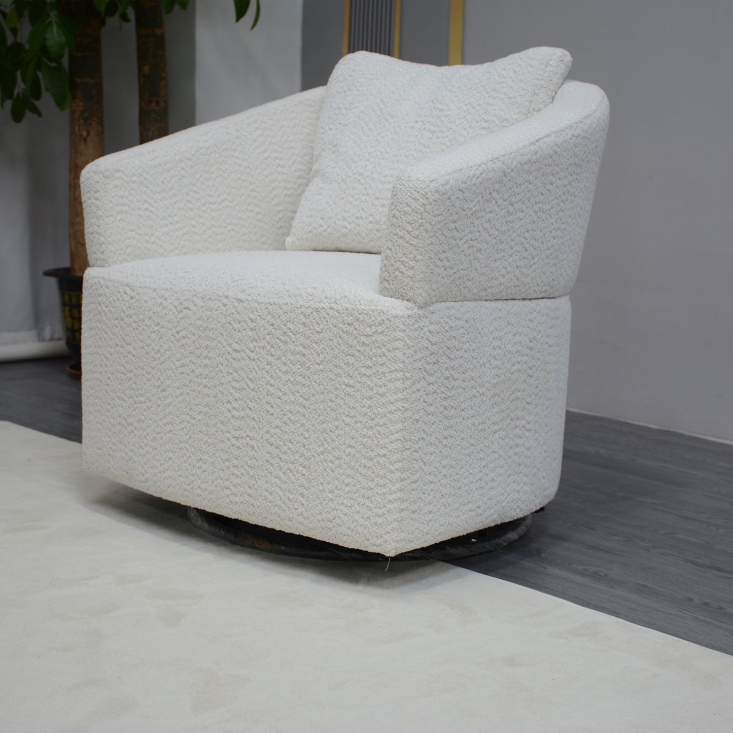 Plush white boucle armchair with a round swivel base perfect for modern living rooms