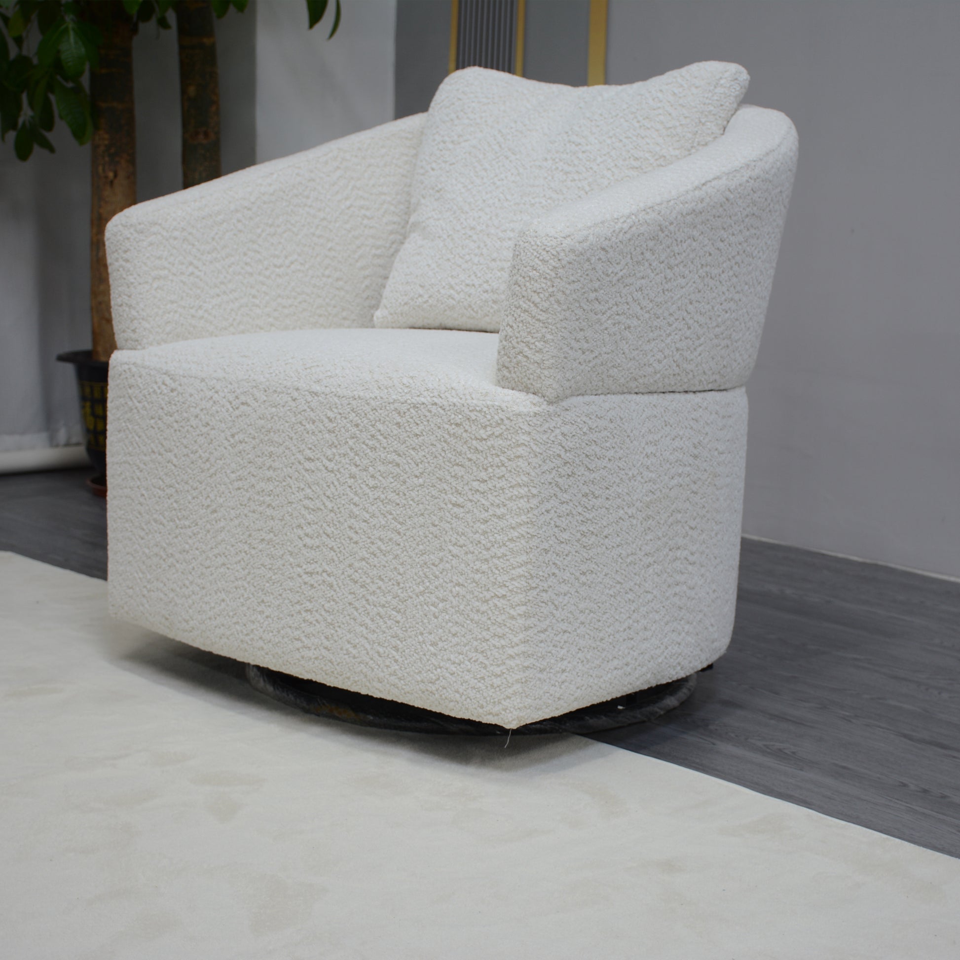 Plush white boucle armchair with a round swivel base perfect for modern living rooms