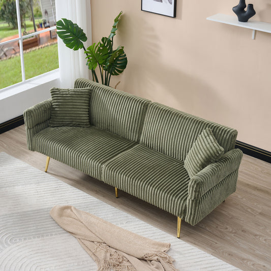 Plush green corduroy sofa with gold legs and matching throw pillows perfect for modern living rooms