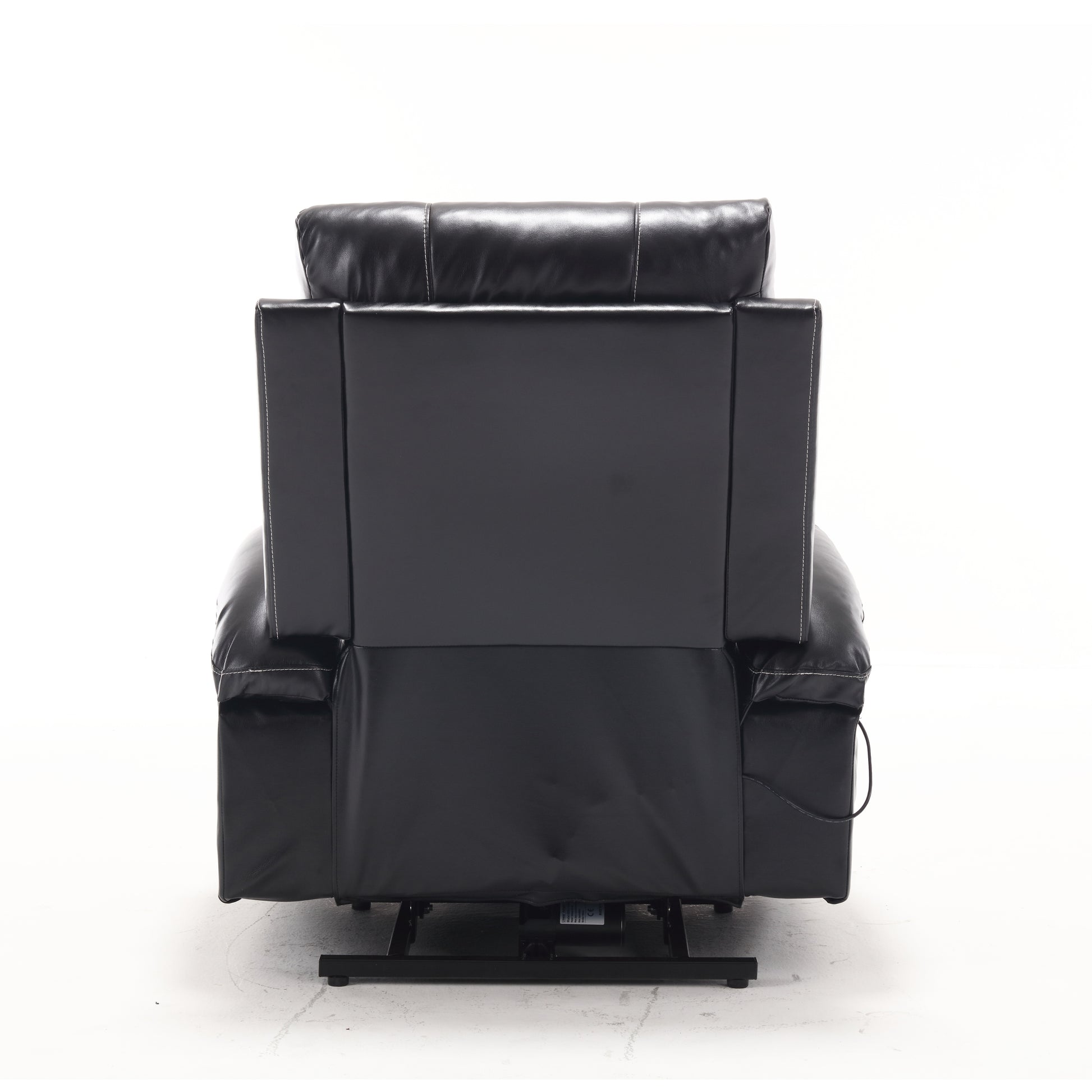 Black leather power recliner chair with white stitching shown from the back