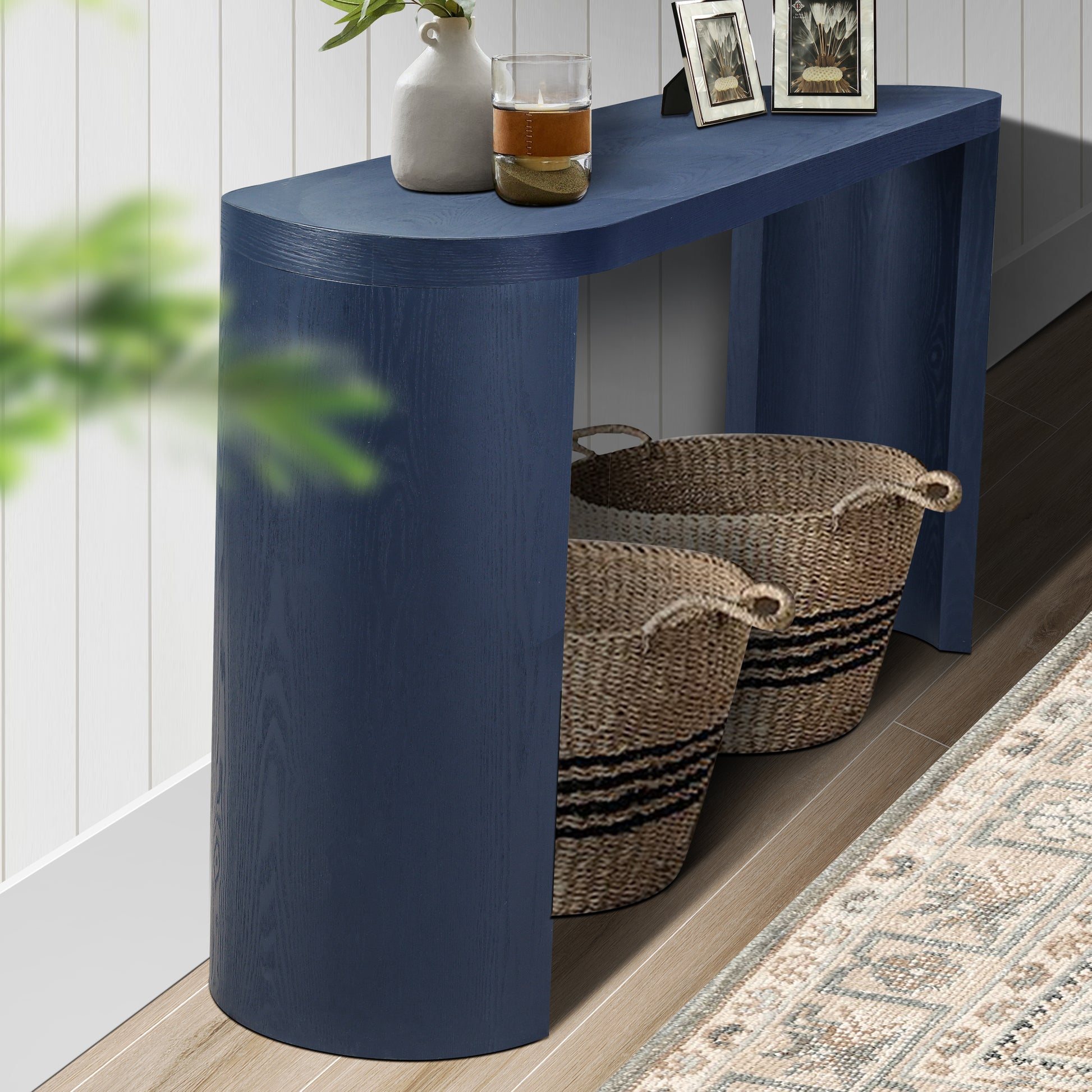 Navy blue curved console table with wood grain texture perfect for entryways