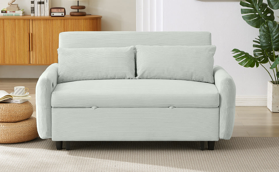 Light blue corduroy sofa bed with two matching throw pillows