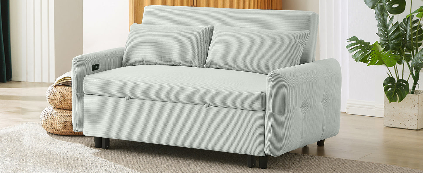 Light blue corduroy sofa bed with two pillows and black legs