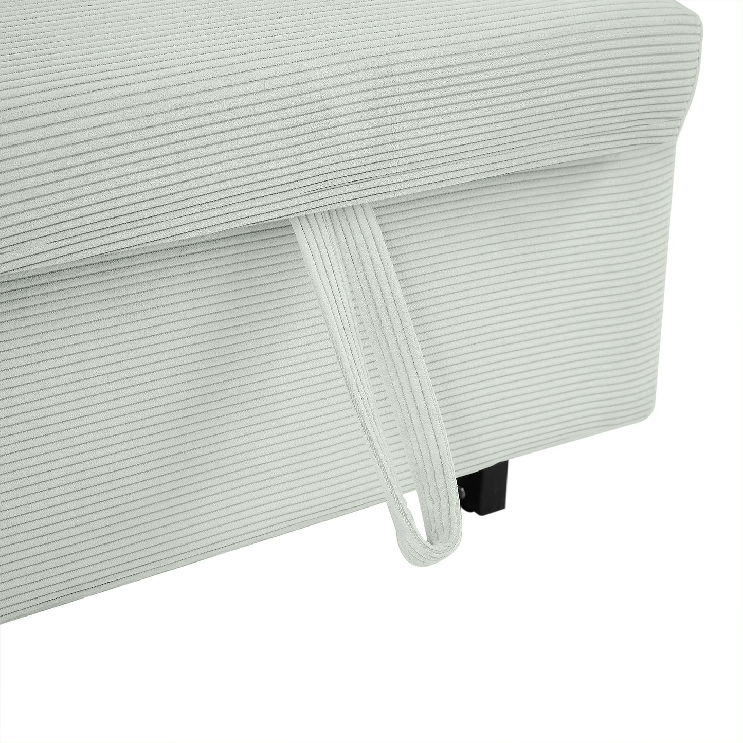 Close up of light gray corduroy fabric on a sofa with a pull tab for easy adjustment