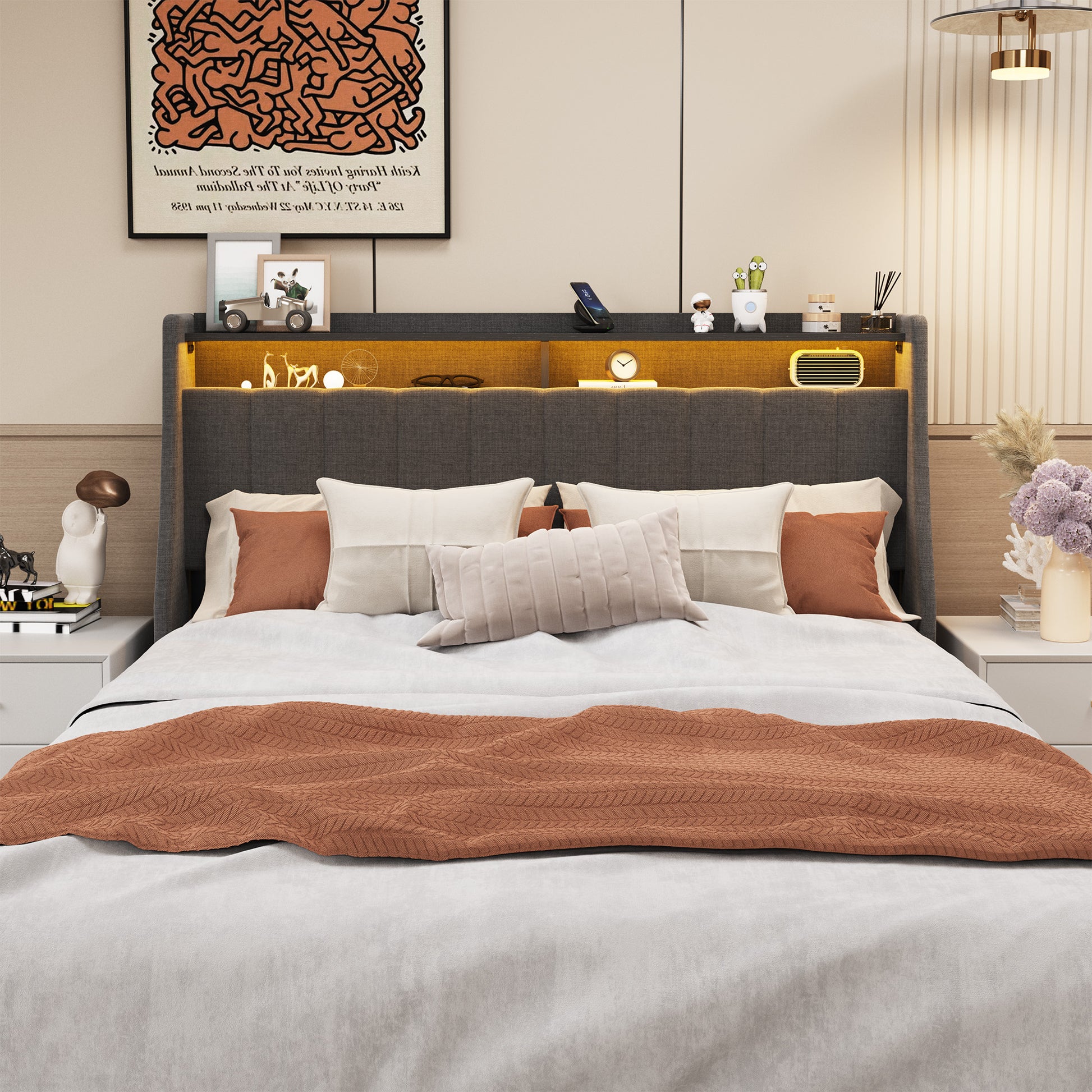 King size upholstered bed with charcoal headboard and warm LED lighting