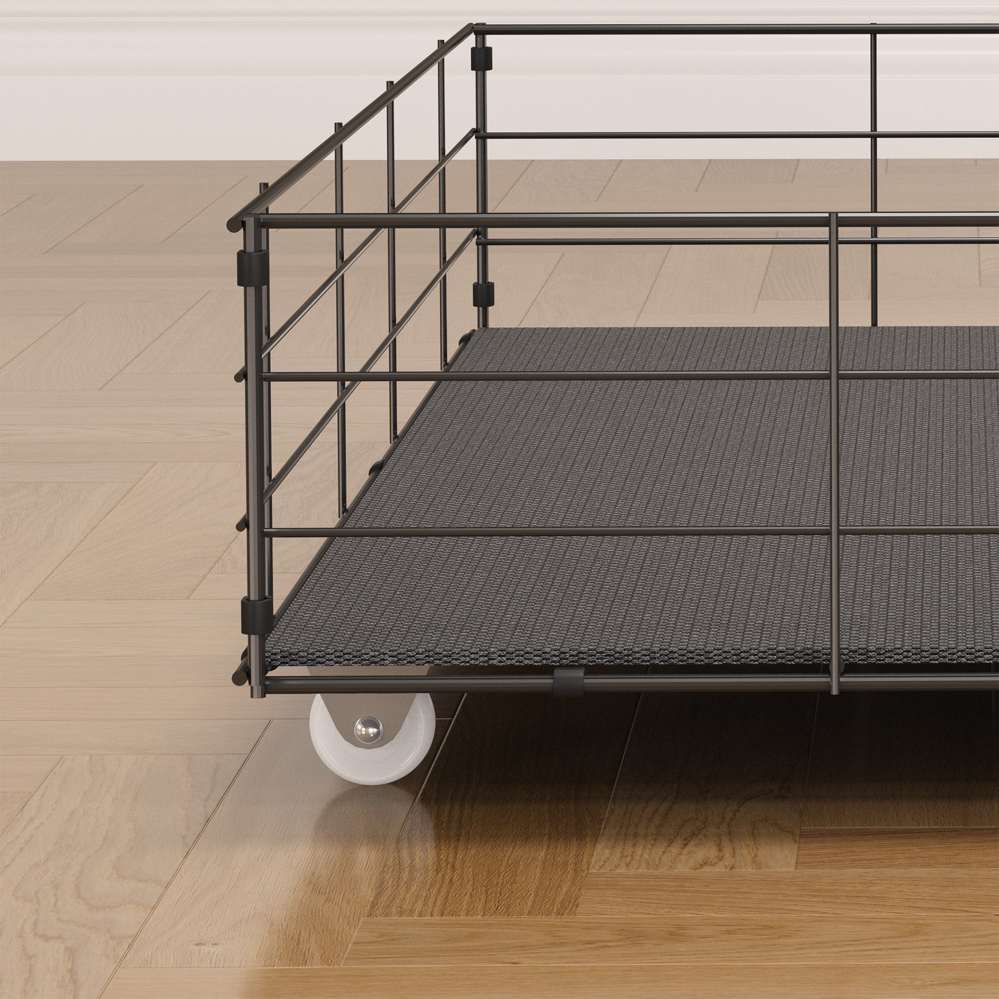 Black metal rolling cart with textured gray platform and white wheel