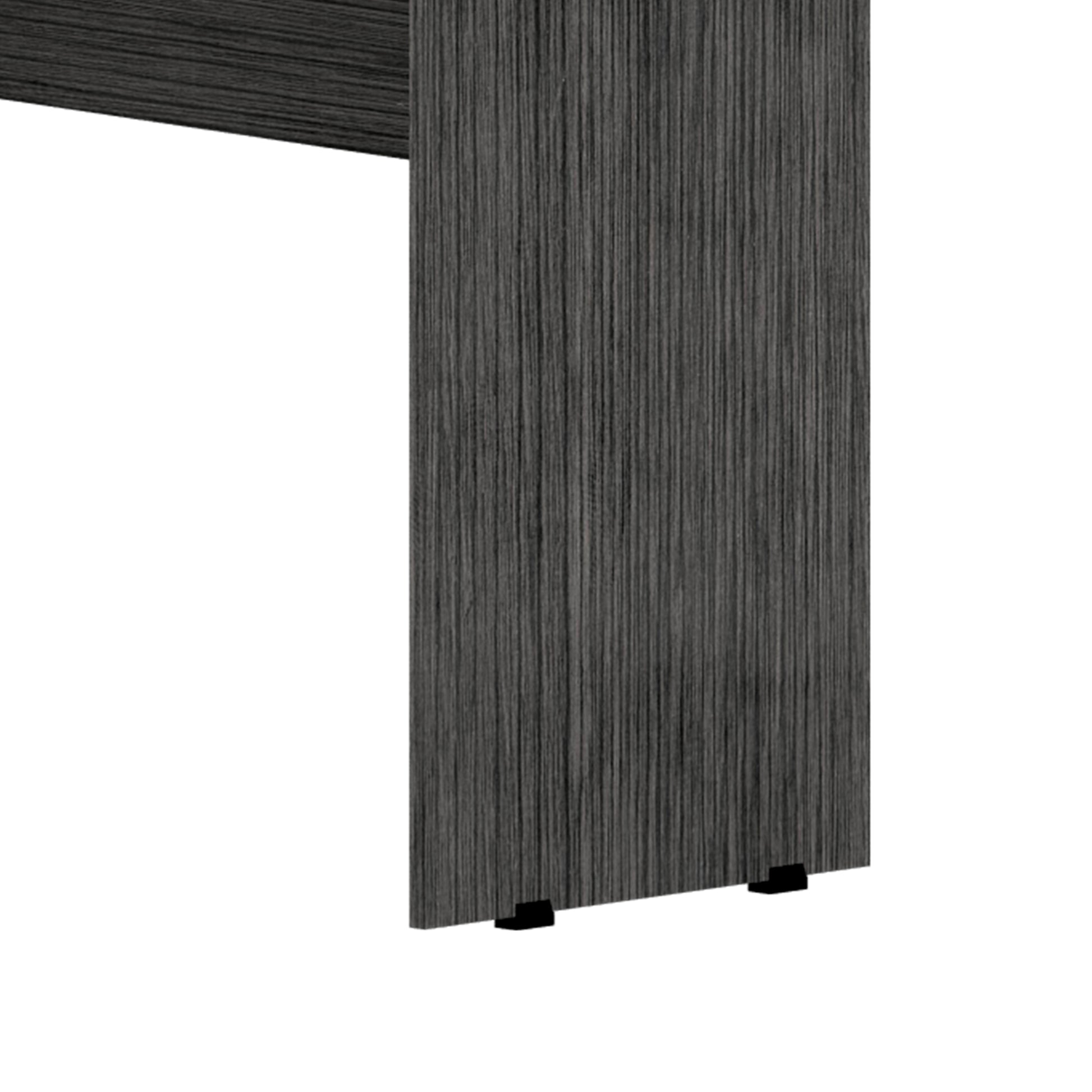 Closeup of a dark gray wood grain veneer desk leg with black levelers
