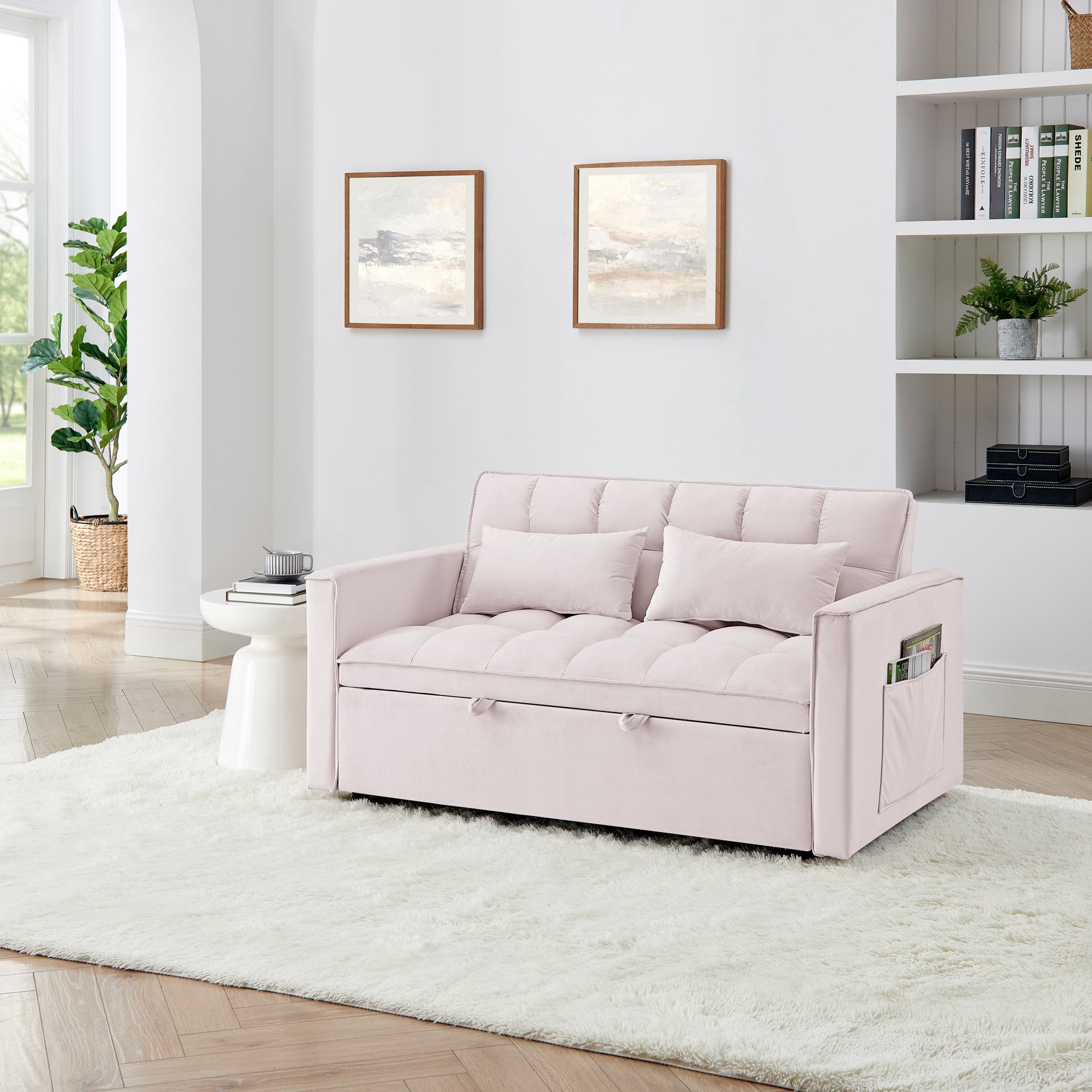 Pink velvet futon couch with tufted cushions and storage drawers perfect for small spaces