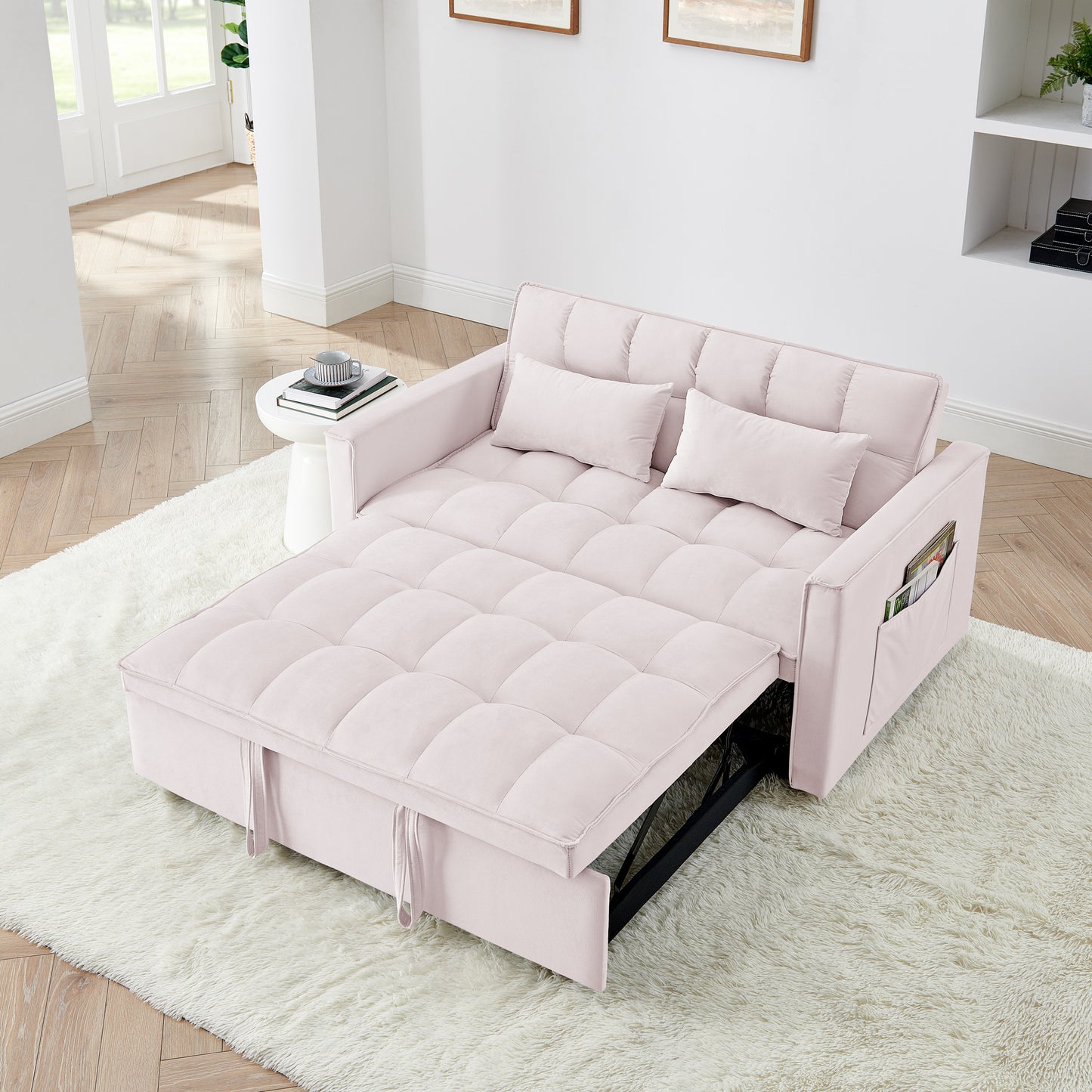 Light pink velvet convertible sofa bed with tufted cushions and side pocket