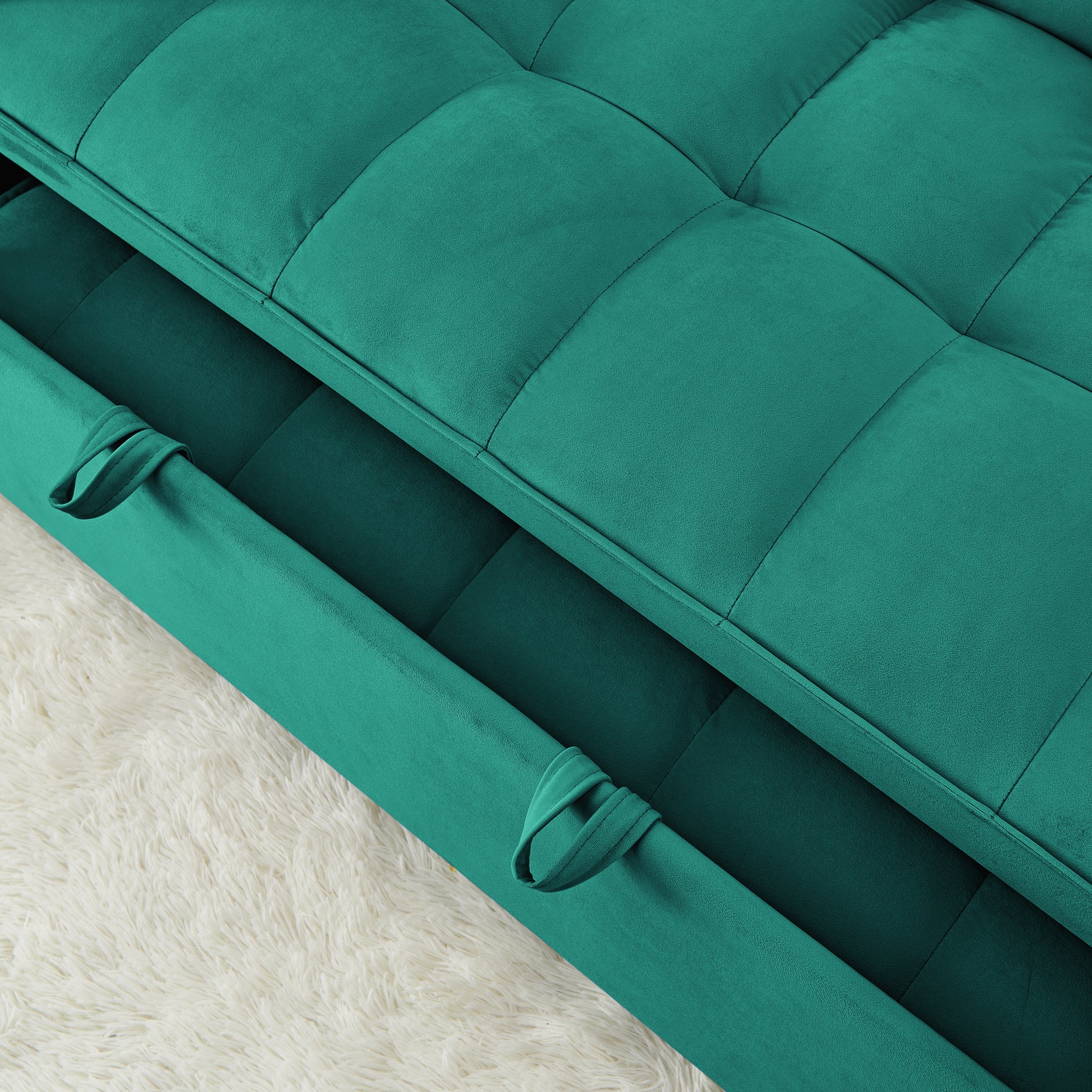 Teal velvet tufted sofa bed with hidden storage compartment and pull tabs