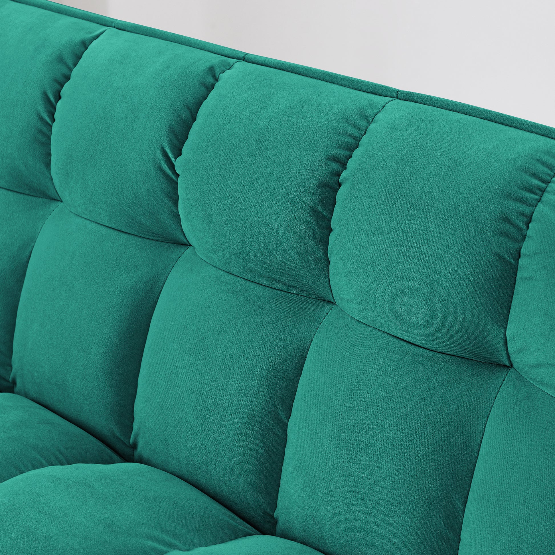 Teal velvet tufted sofa detail soft fabric texture for modern living room seating