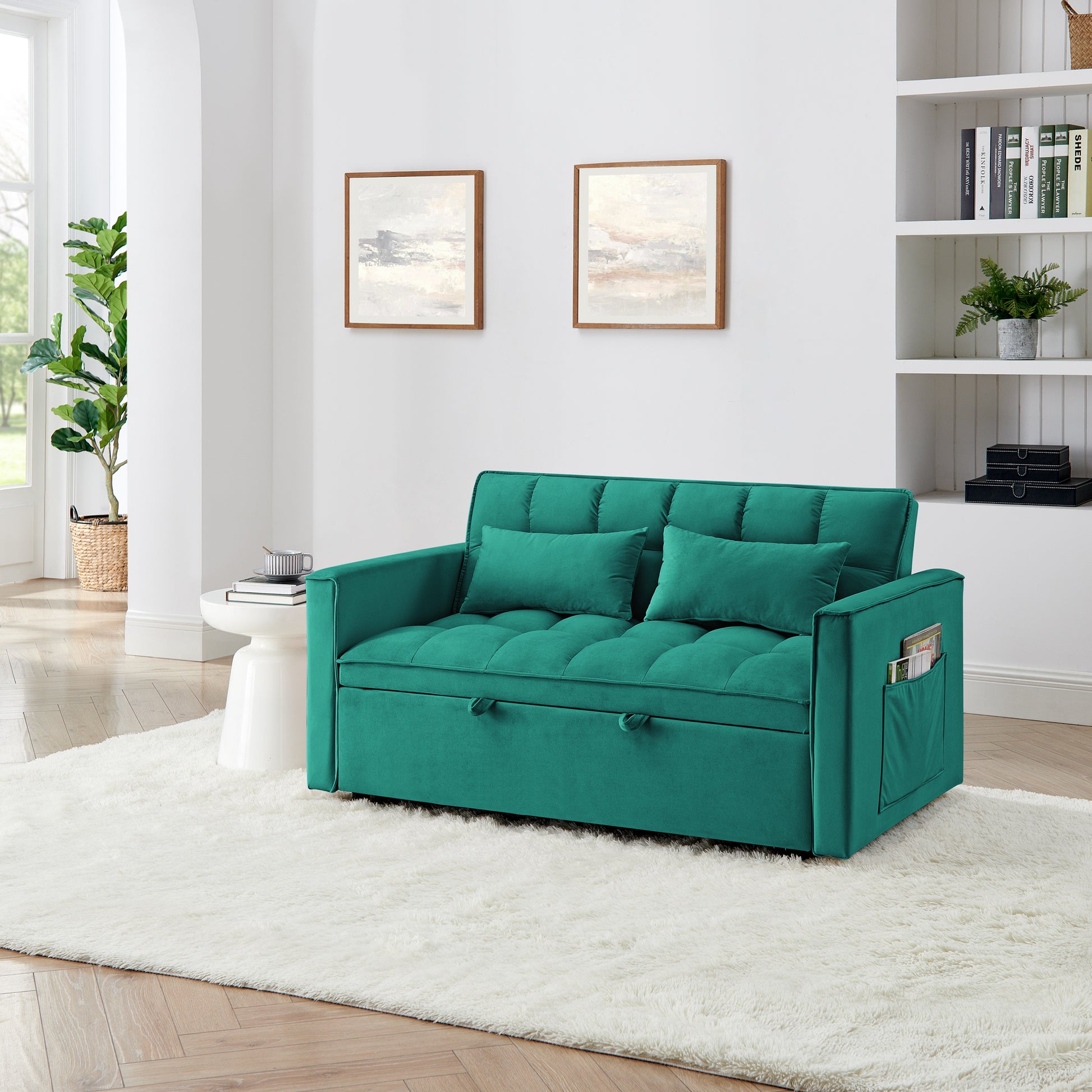 Teal velvet sofa bed with tufted cushions and convenient side pocket for magazines