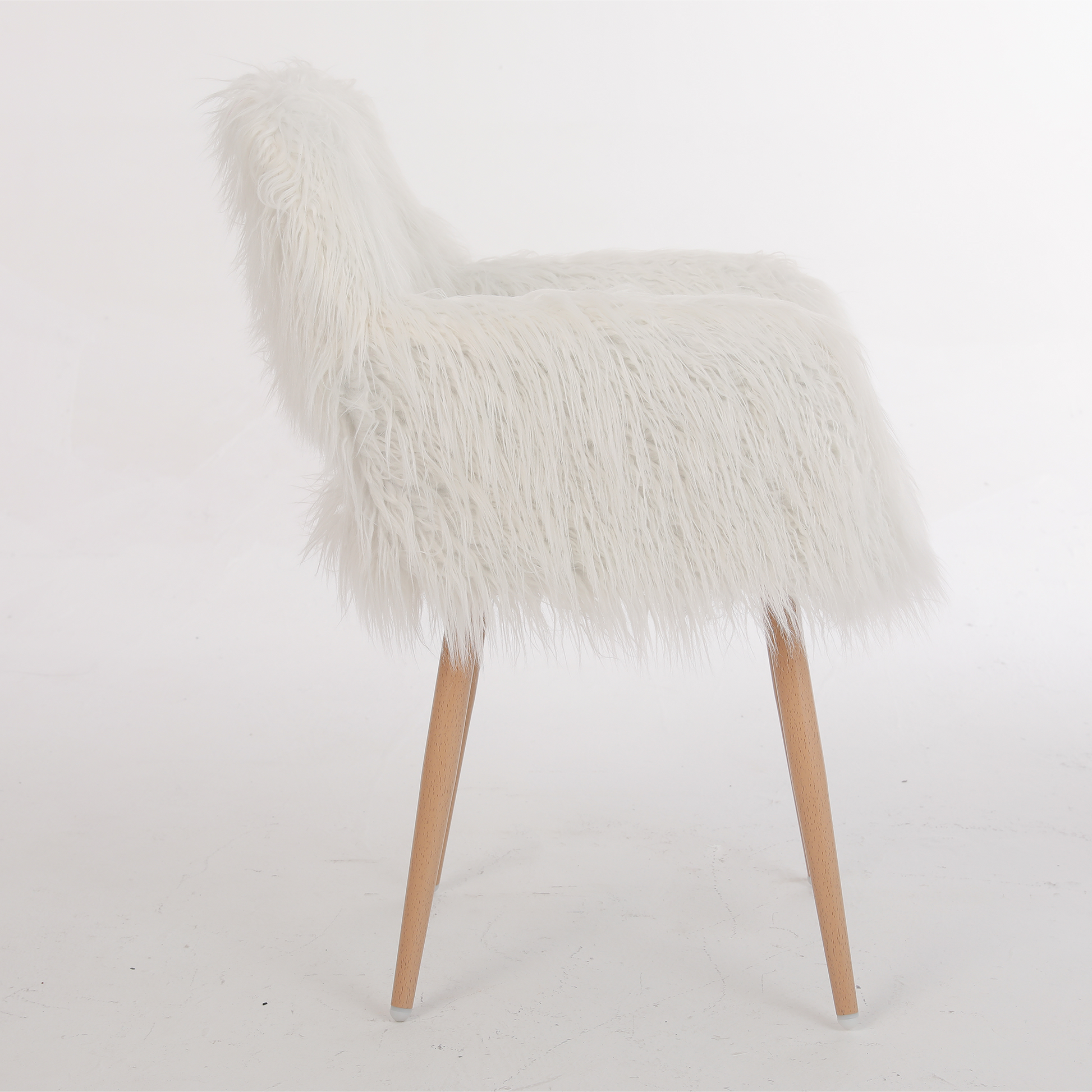 White fluffy accent chair with natural wood legs and midcentury modern design