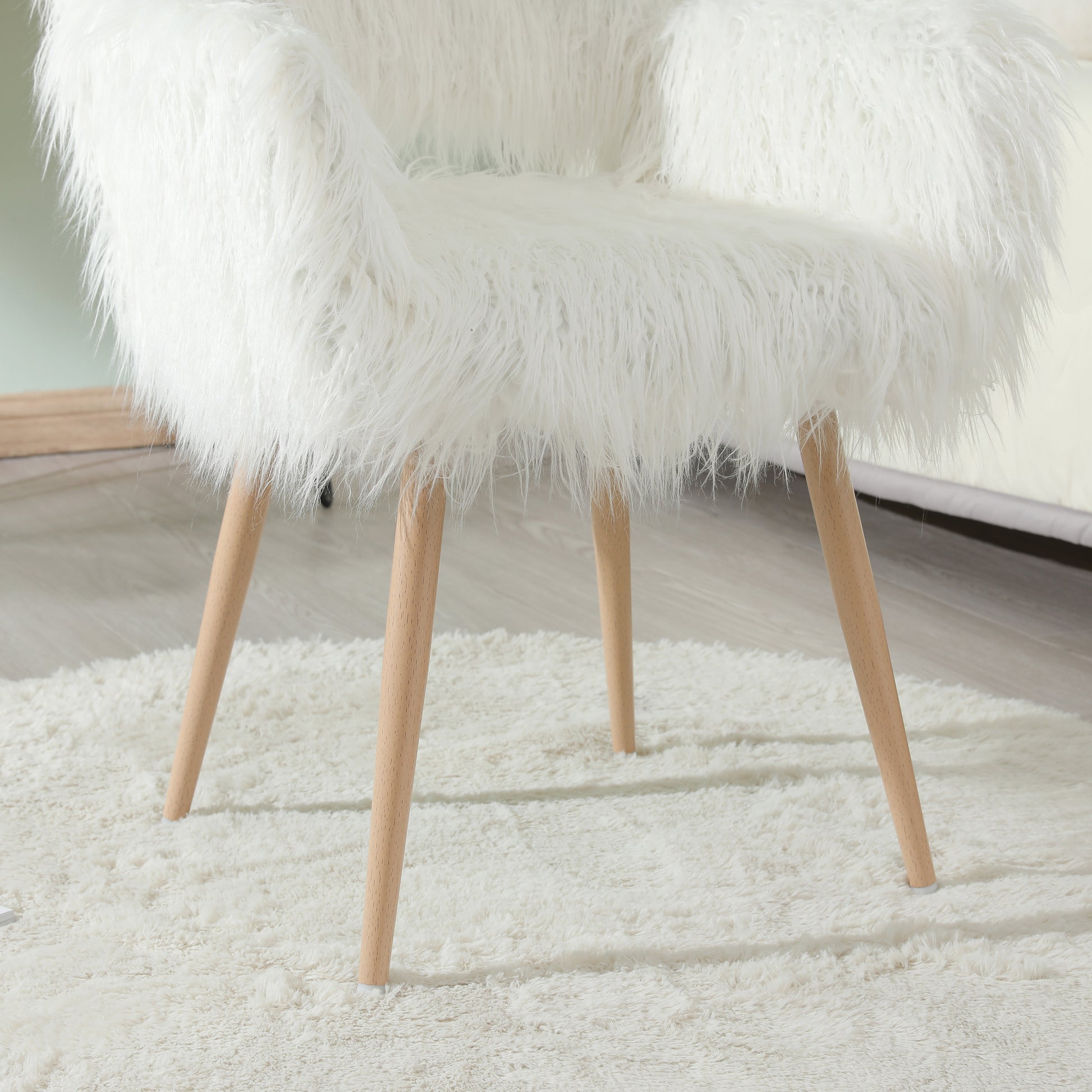 White faux fur accent chair with wooden legs cozy seating option