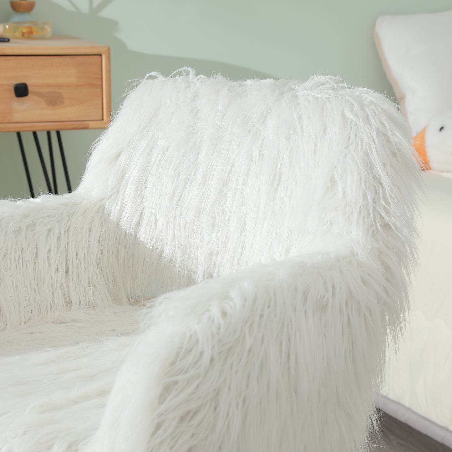 Plush white faux fur accent chair with shaggy texture for modern living rooms