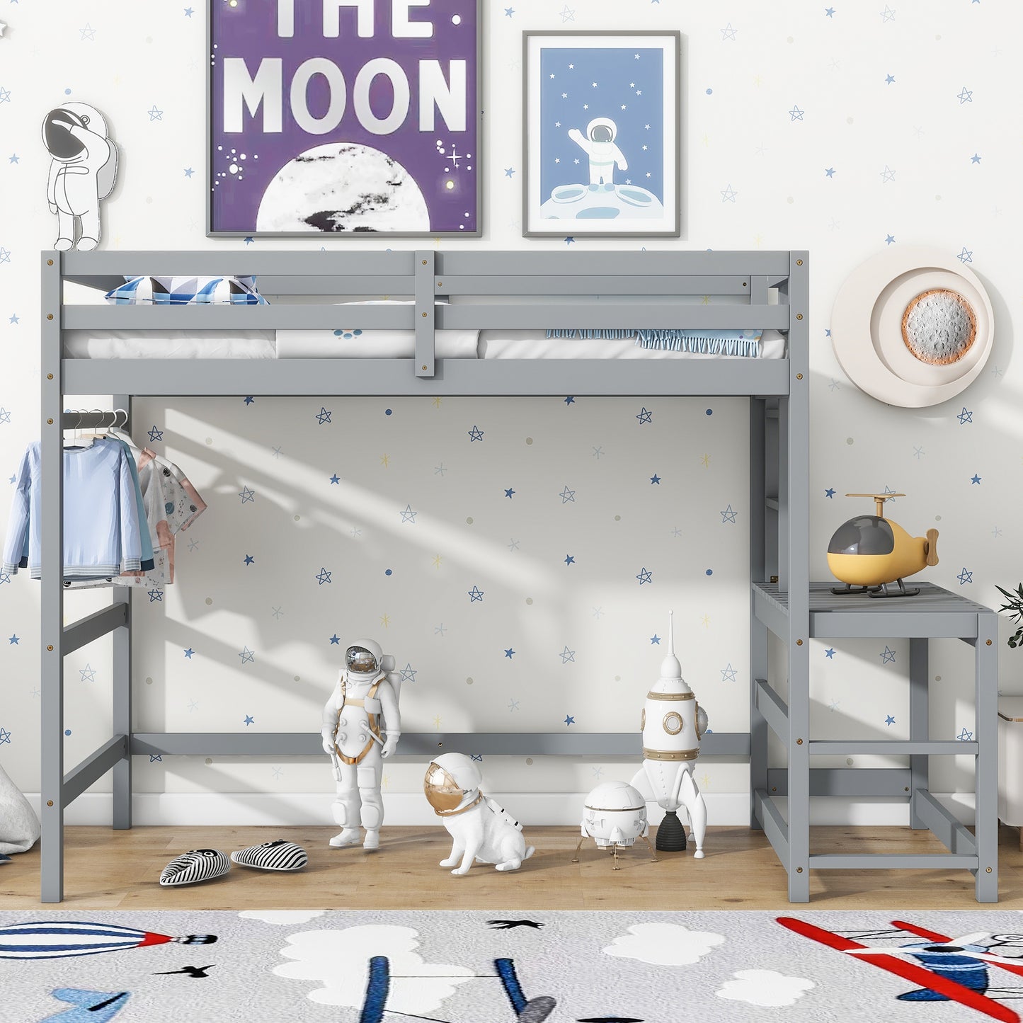 Gray wooden loft bed with bedding and clothes hanging