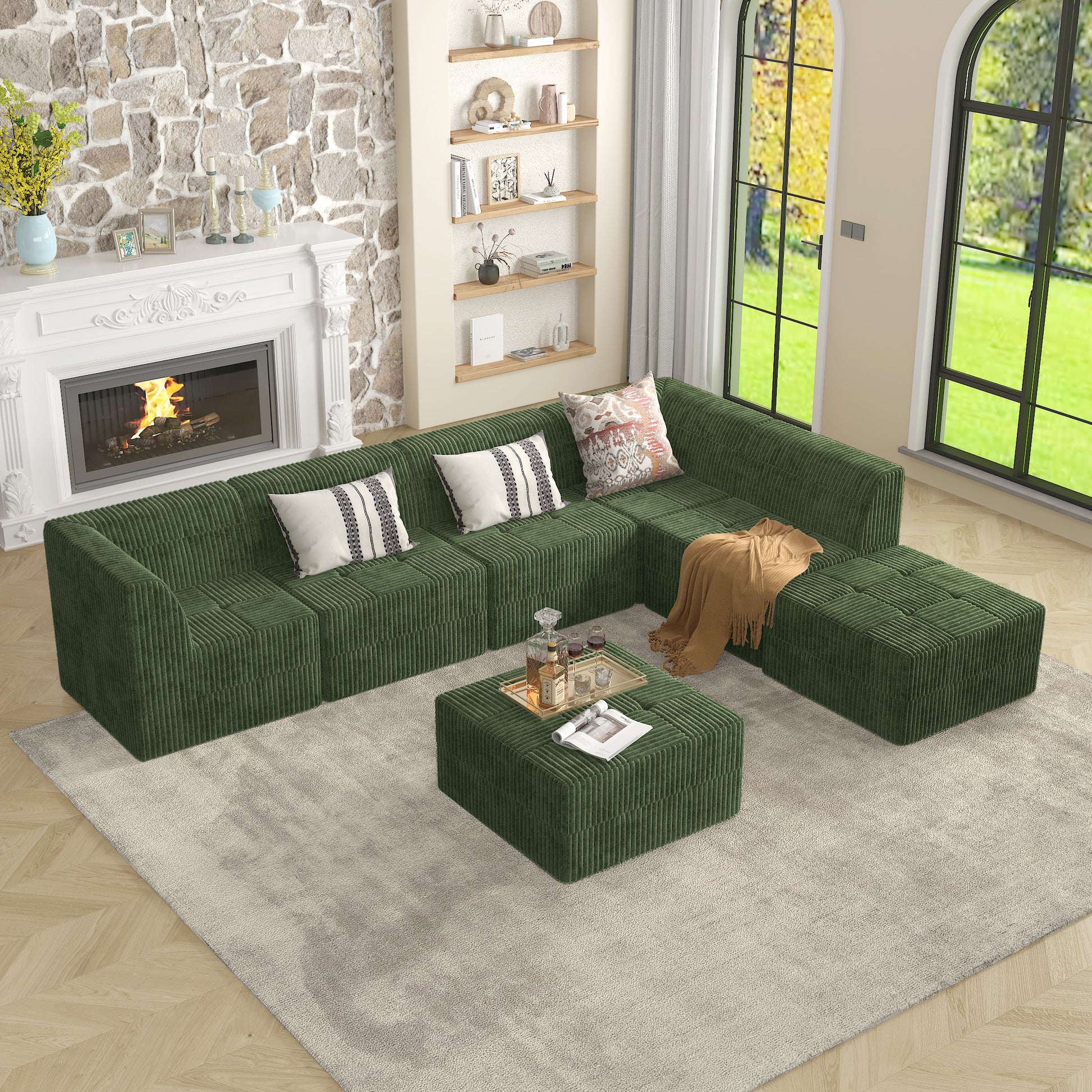 Modular corduroy sectional sofa in deep forest green with decorative pillows