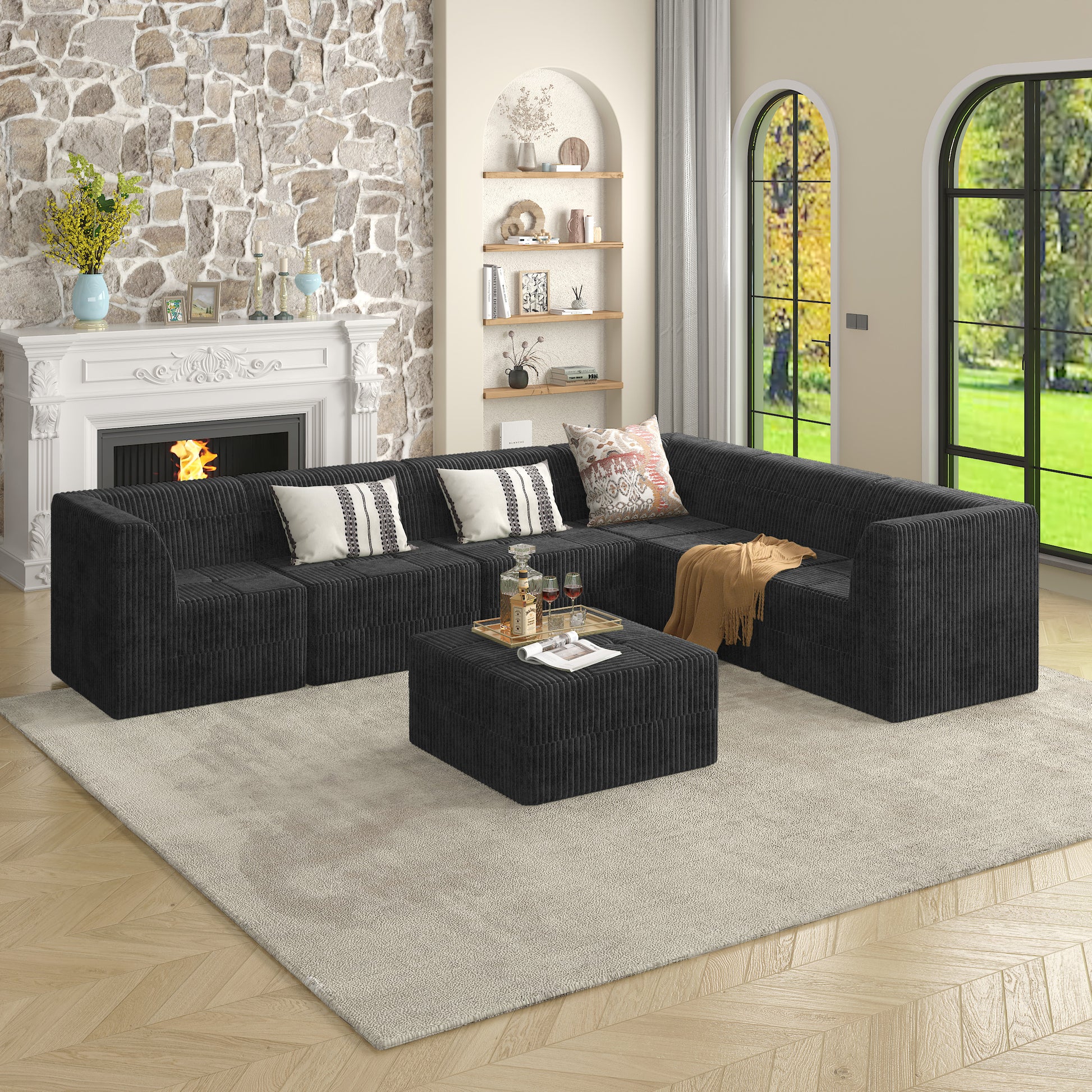 Black corduroy sectional sofa with plush cushions and an ottoman for modern living rooms