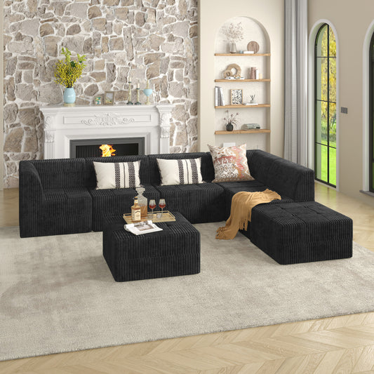 Black corduroy sectional sofa with plush cushions and ottoman styled for modern living rooms