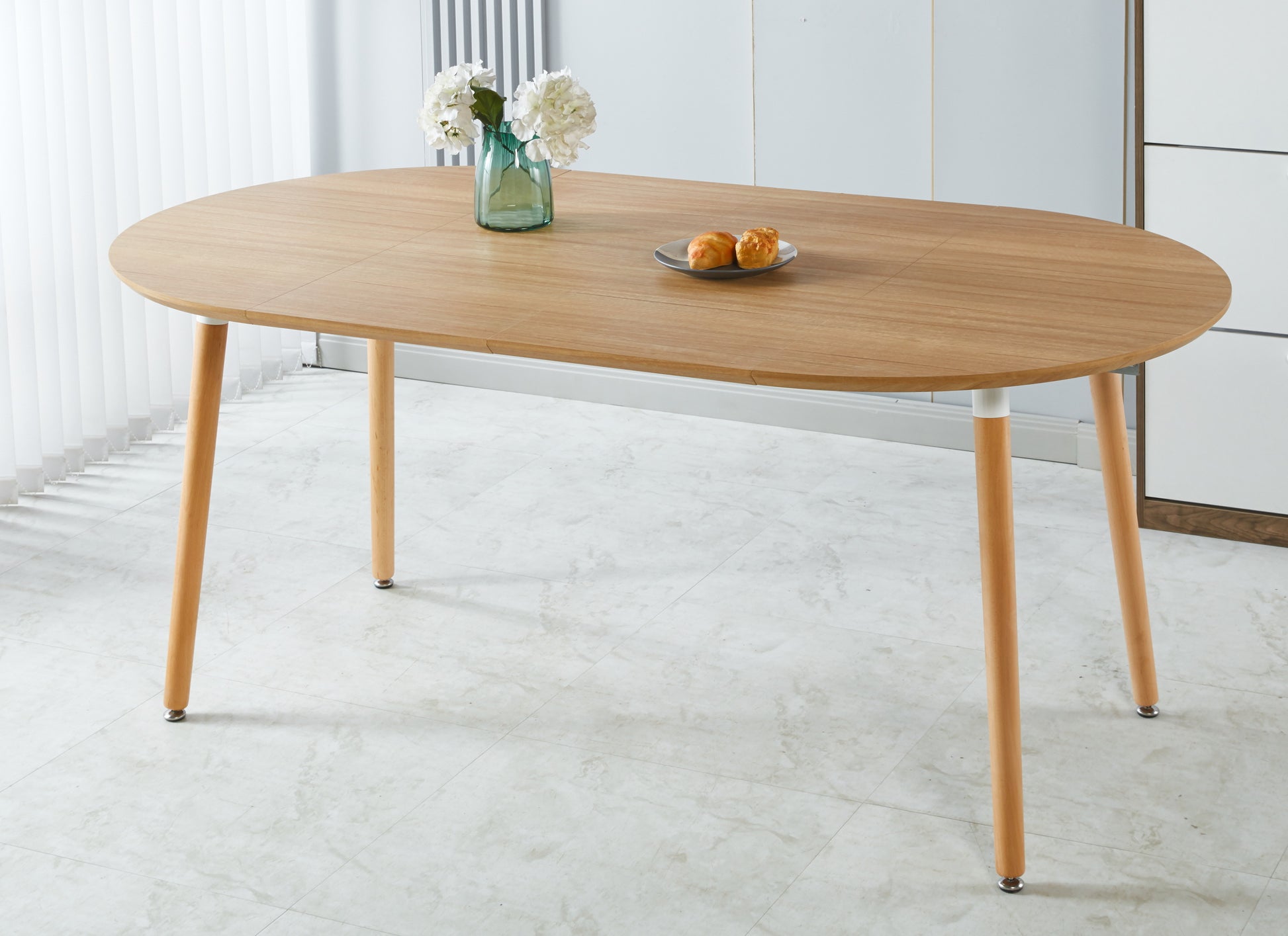 Light oak wood dining table oval shape midcentury modern design seats four