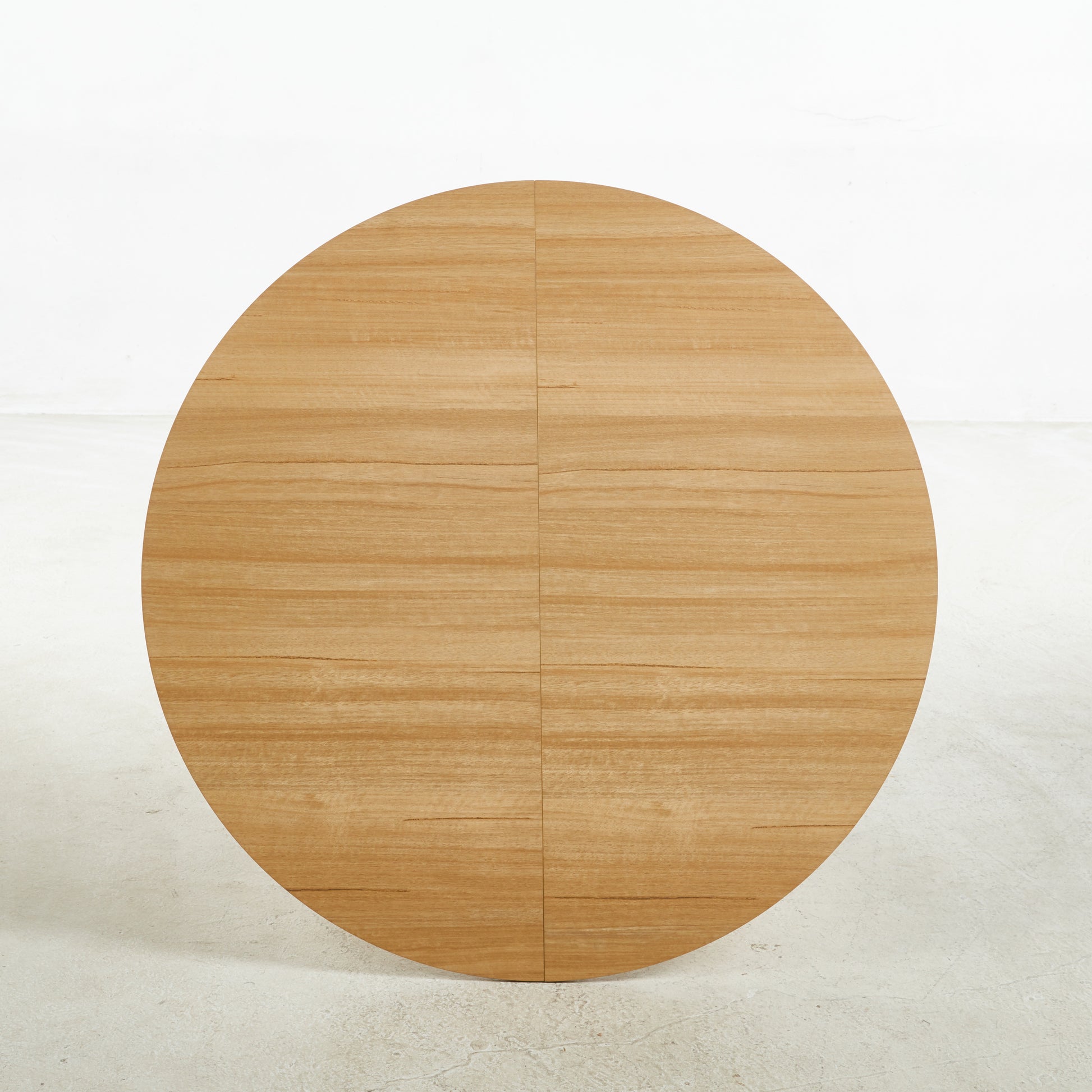 Round oak veneer tabletop with visible wood grain