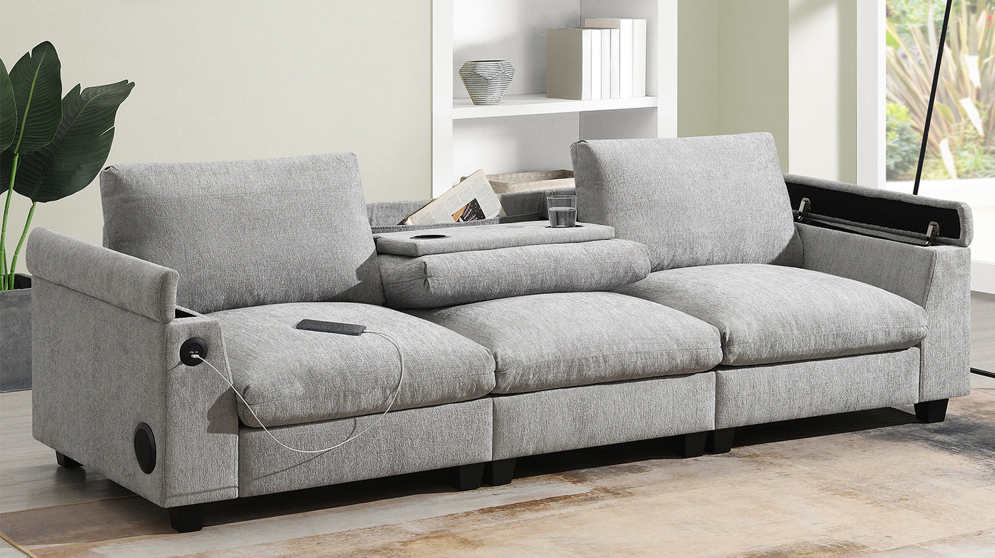 Grey fabric sectional sofa with builtin USB charging ports and speakers