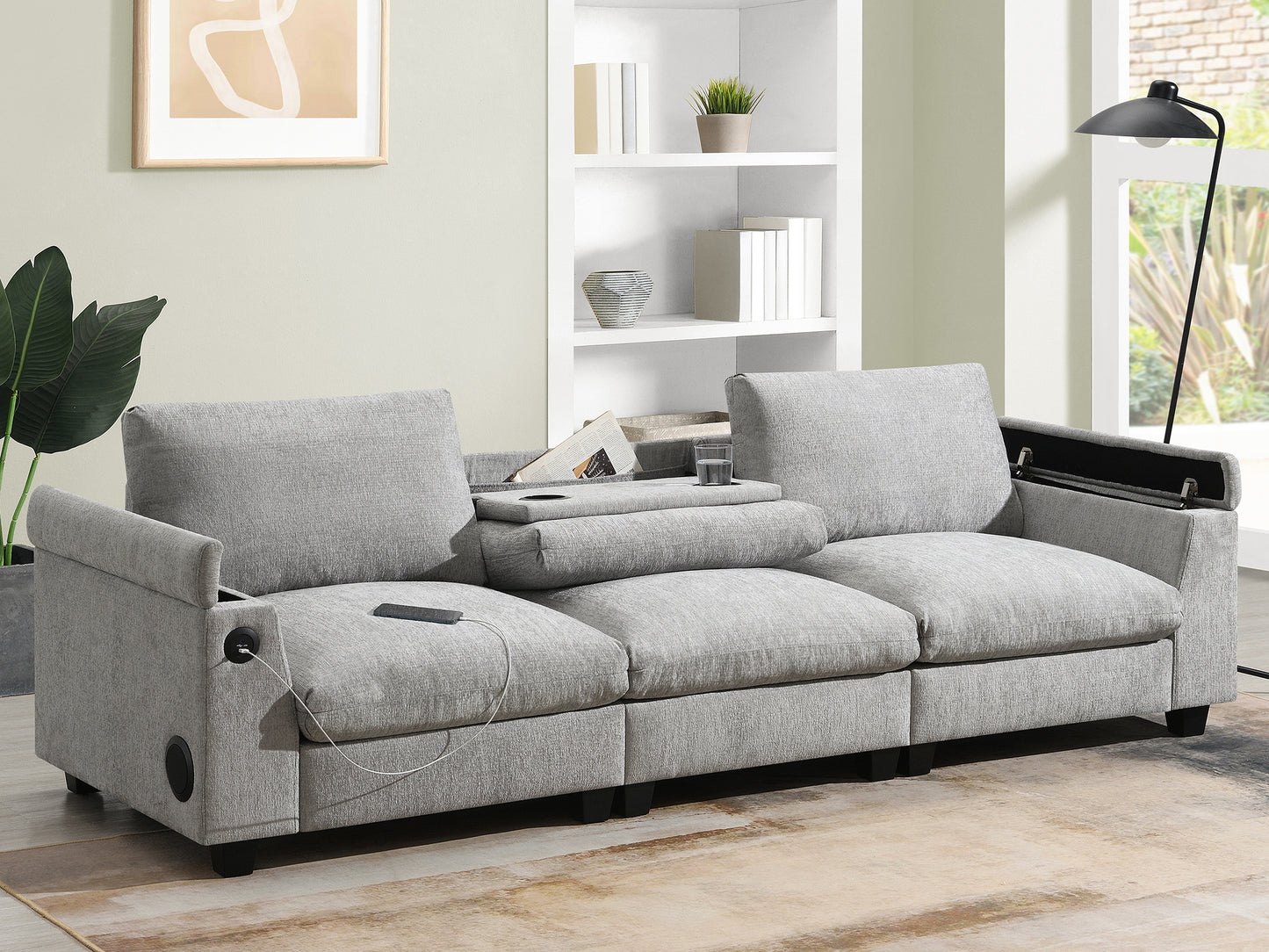 Modern grey fabric sofa with builtin USB charging ports and integrated speaker system for a connected living room