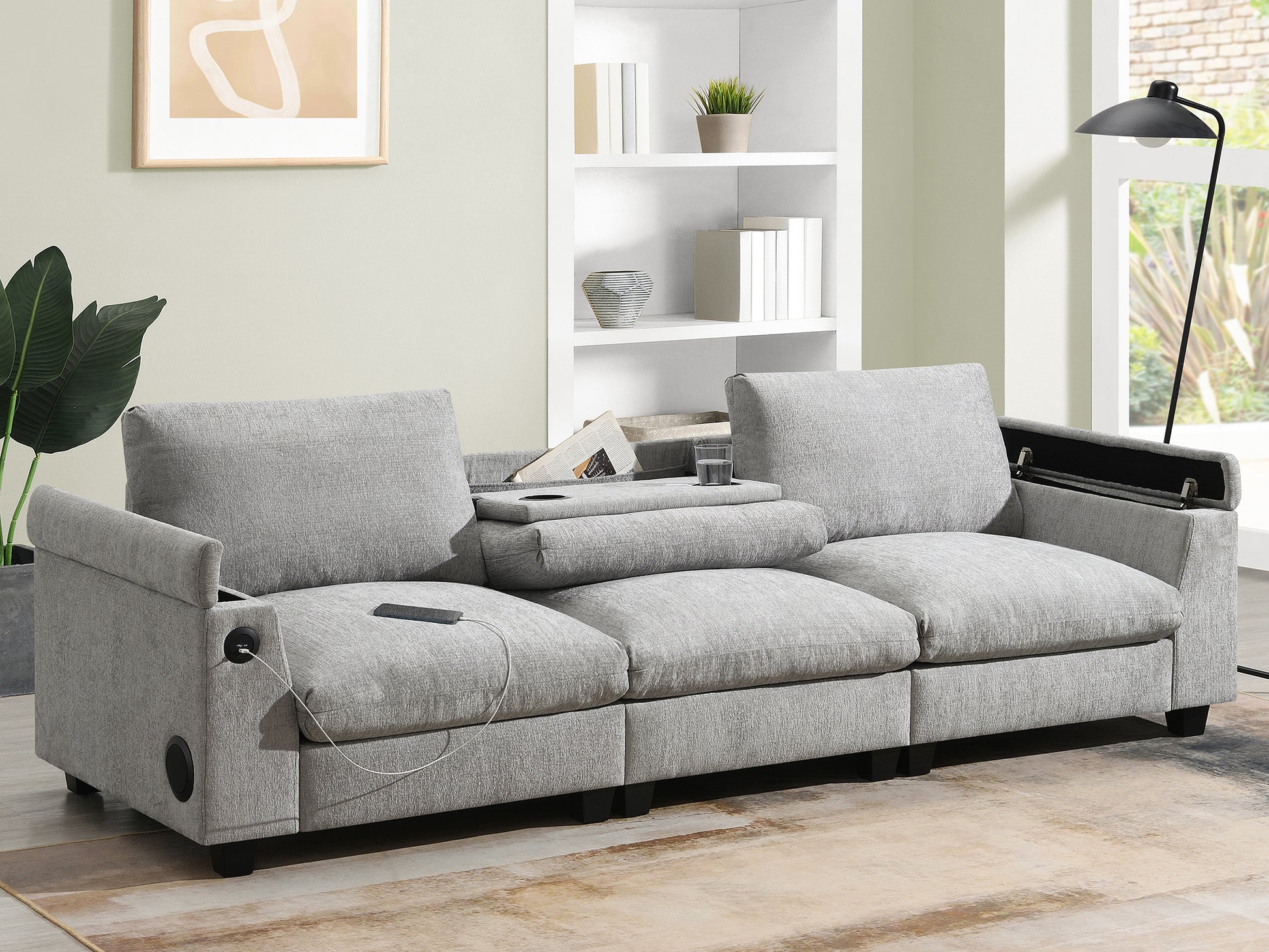 Modern grey fabric sofa with builtin USB charging ports and integrated speaker system for a connected living room