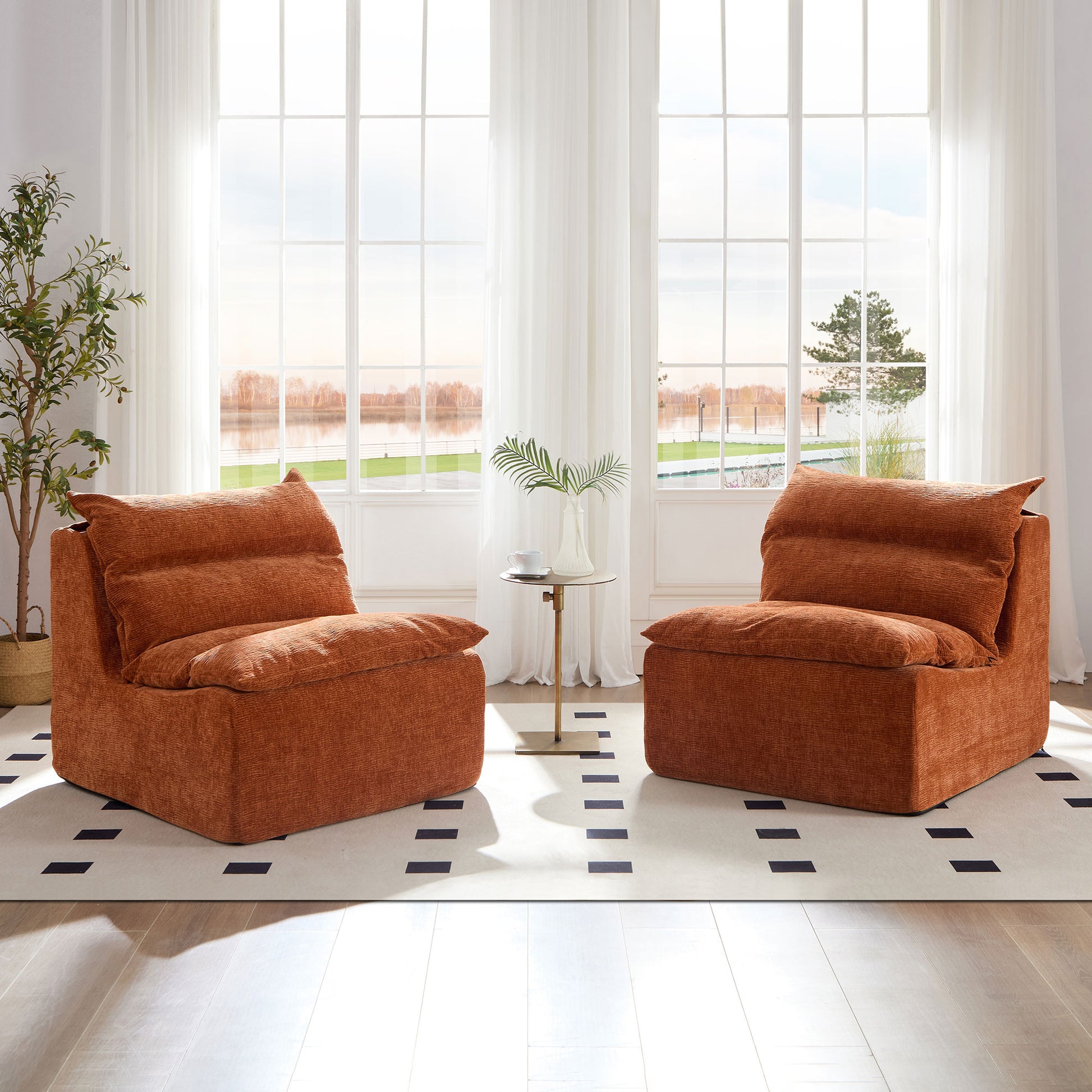 Two burnt orange textured accent chairs with deep cushions arranged in a living room setting