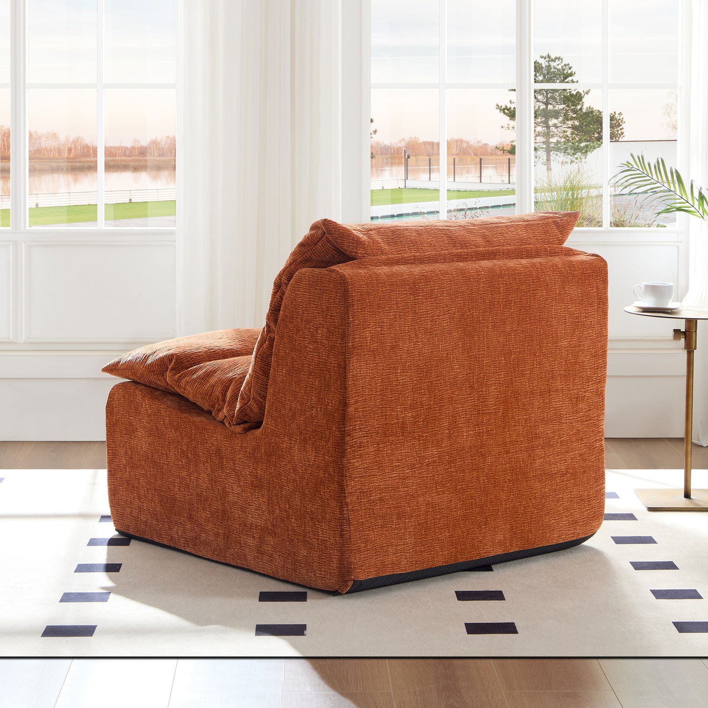 Cozy burnt orange armchair with textured fabric and plush cushions for relaxation
