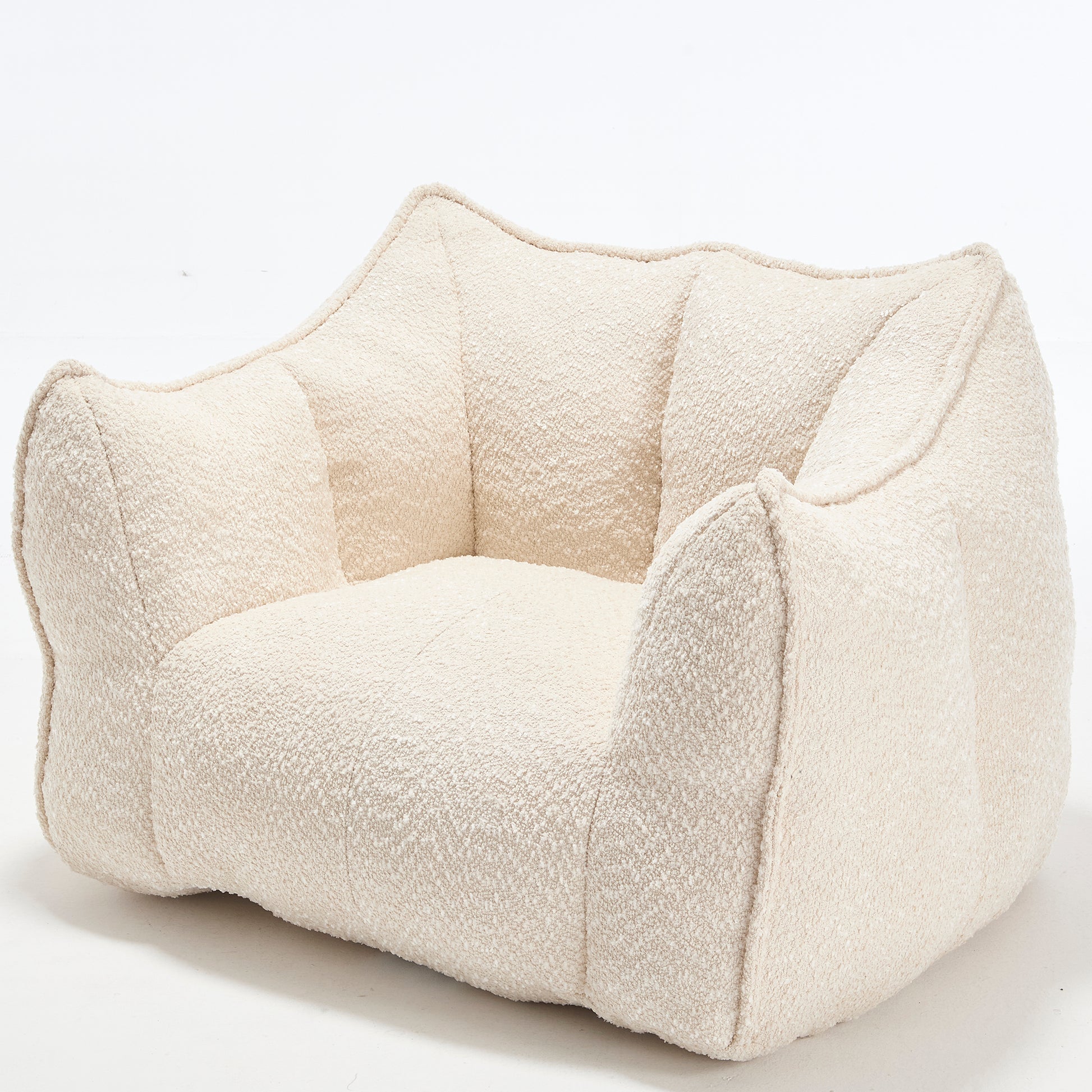 Textured cream boucle armchair with a unique sculptural design for modern living spaces