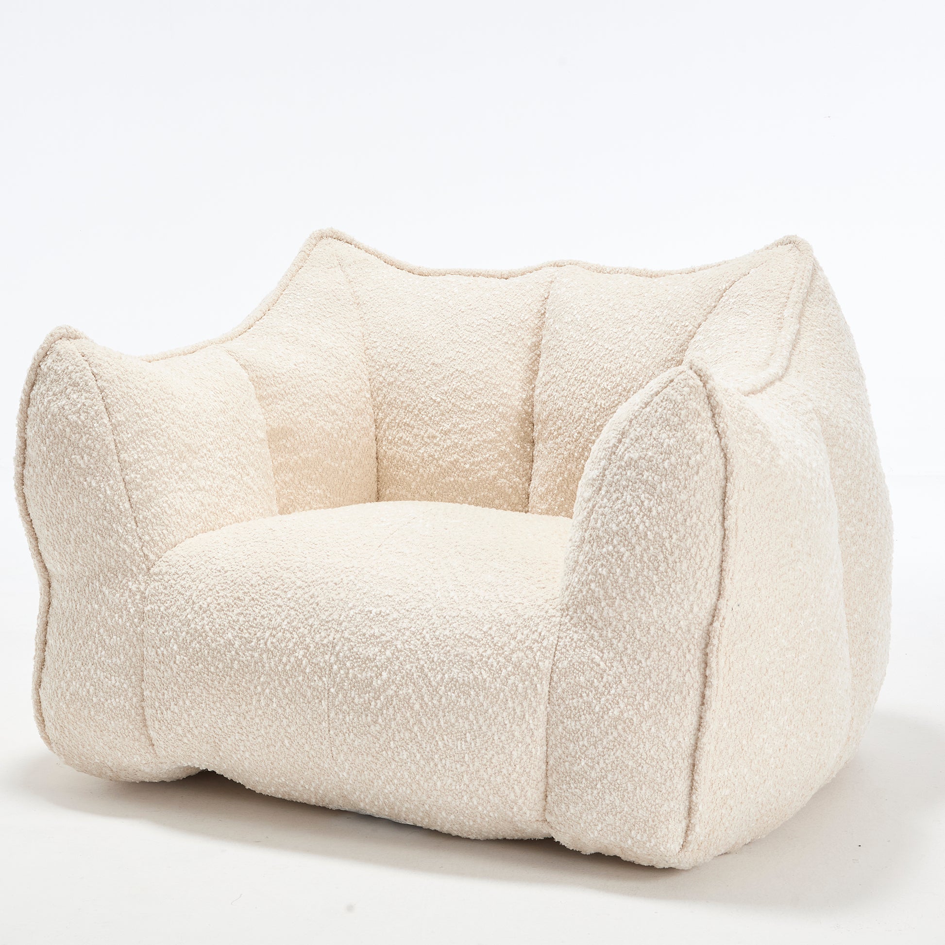 Cream boucle armchair with plush rounded arms and a lowprofile design perfect for a modern living room