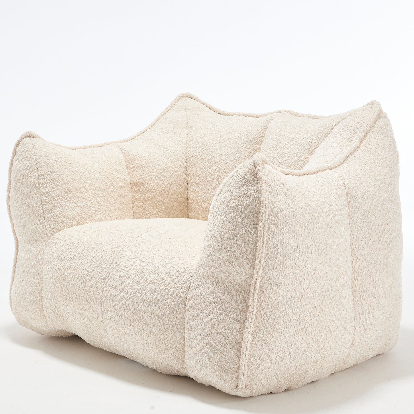 Textured cream boucle armchair with plush enveloping cushions for ultimate comfort