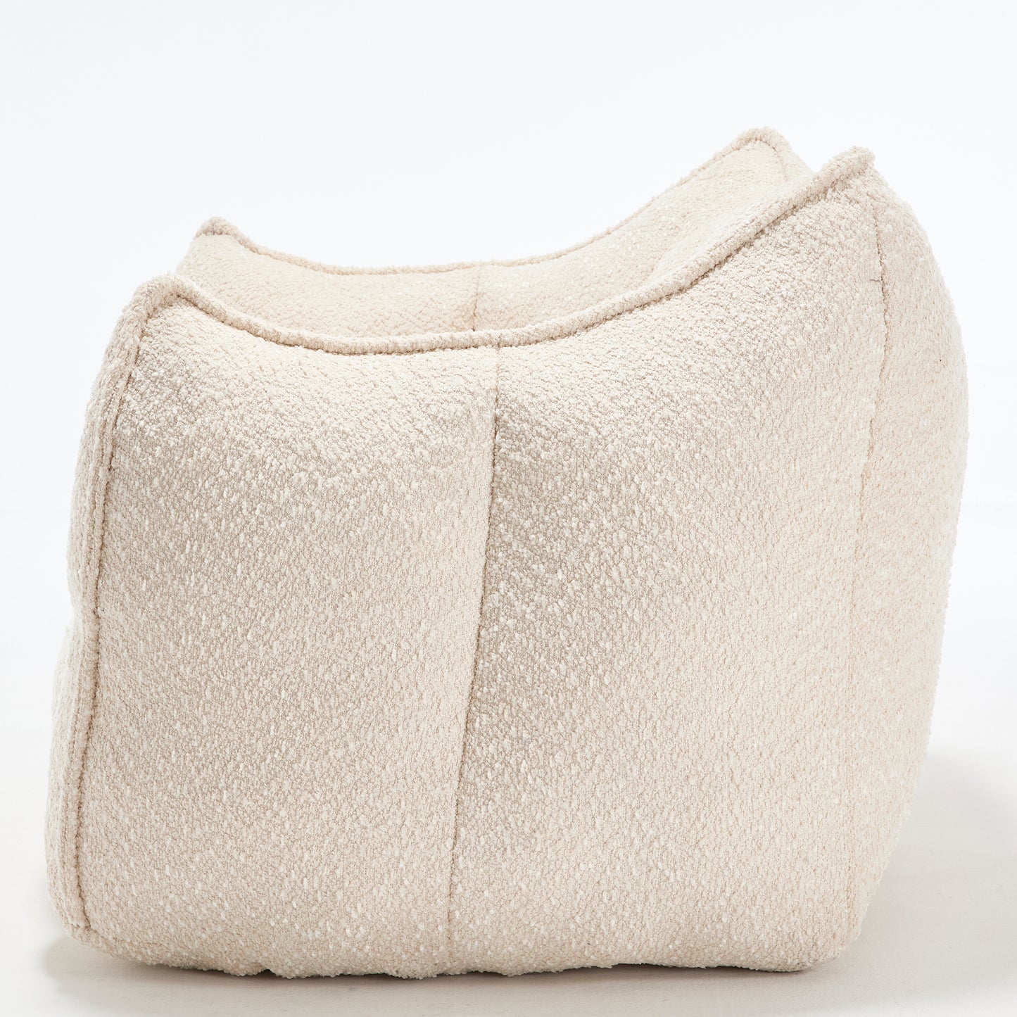 Curved boucle fabric ottoman in cream a versatile accent piece for any living space
