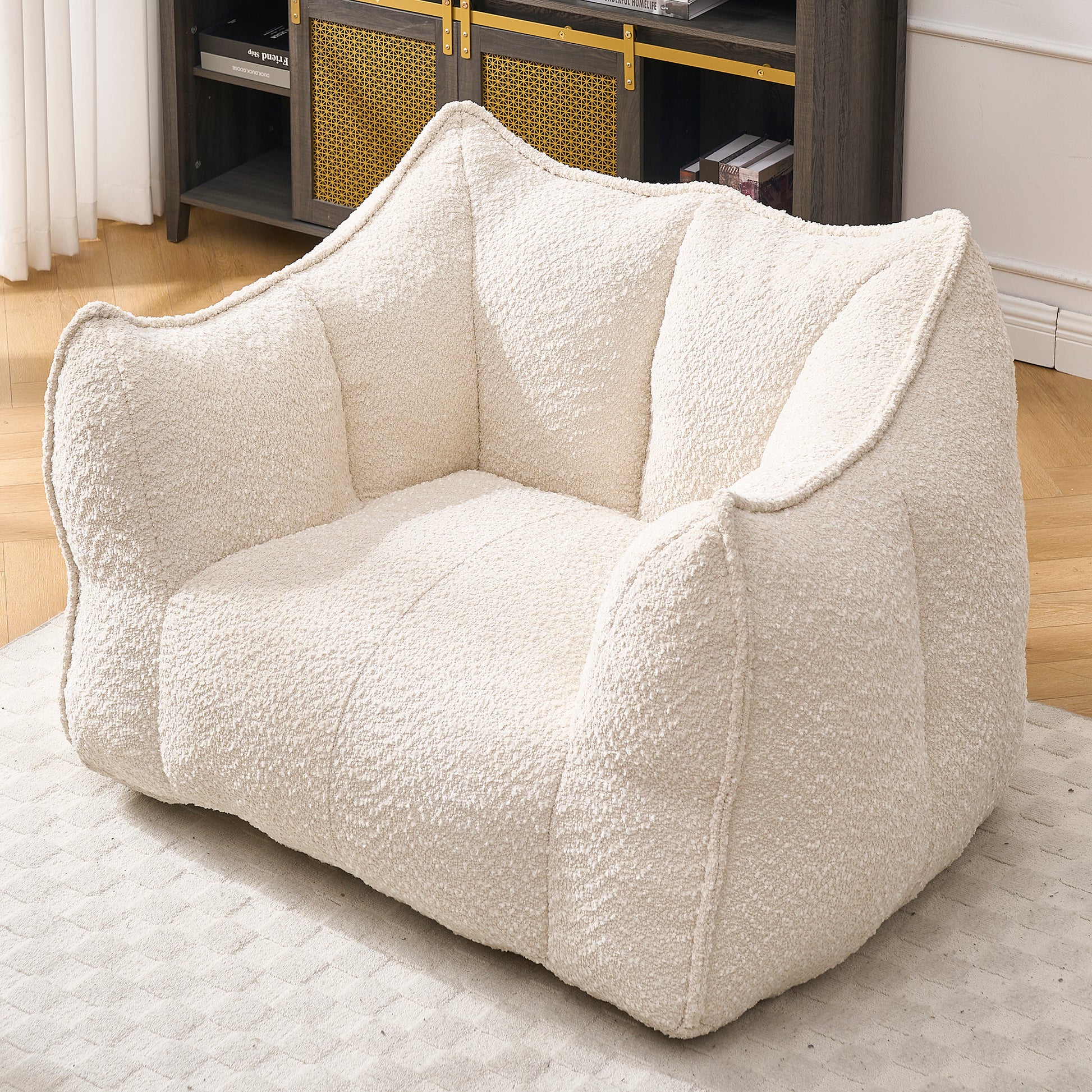 Cream boucle accent chair with plush oversized cushions for ultimate comfort