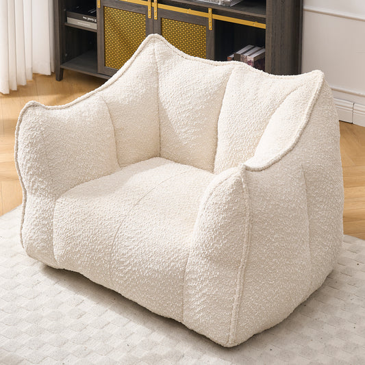 Cream boucle accent chair with plush oversized cushions for ultimate comfort