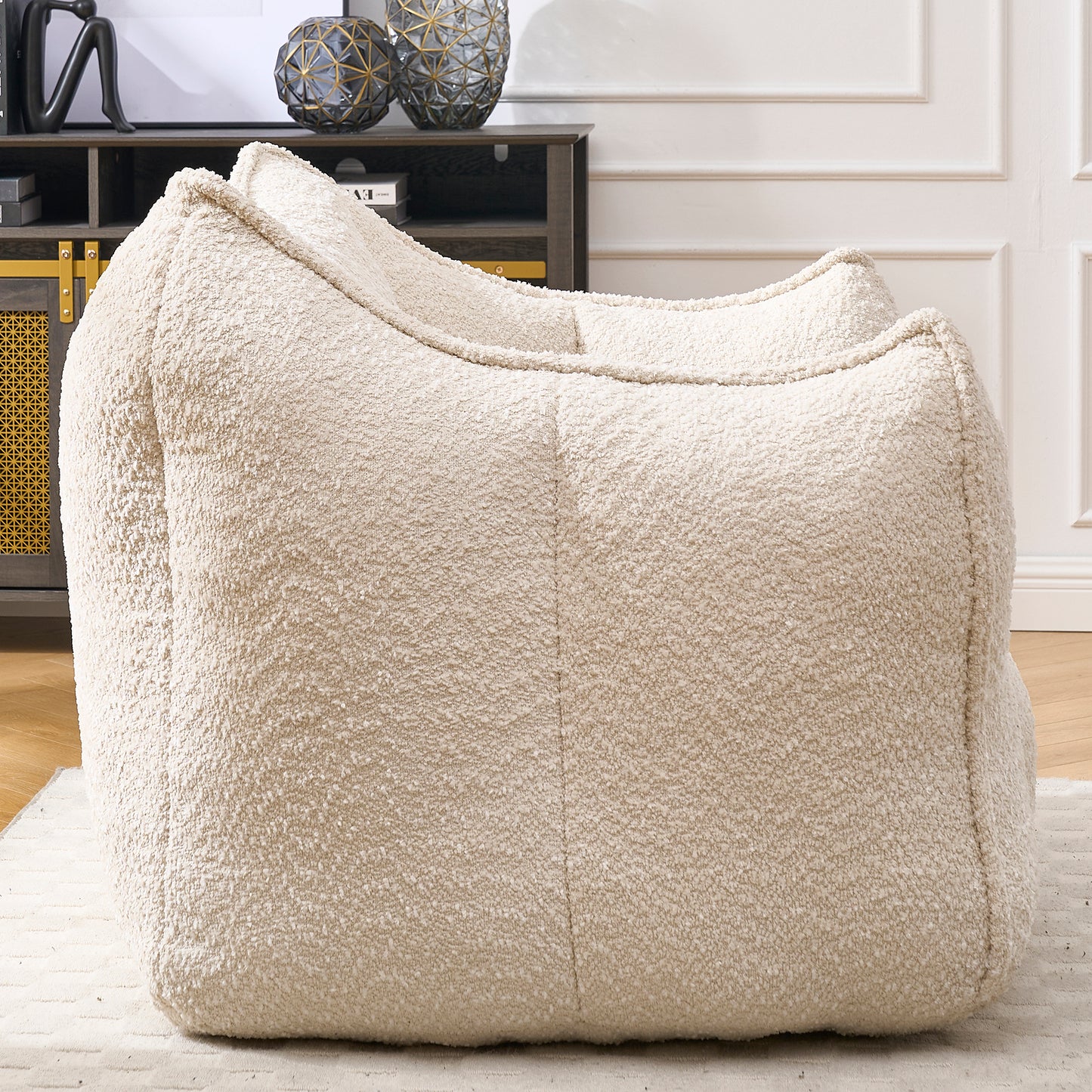 Plush cream boucle fabric bean bag chair offering ultimate comfort and a cozy living room accent