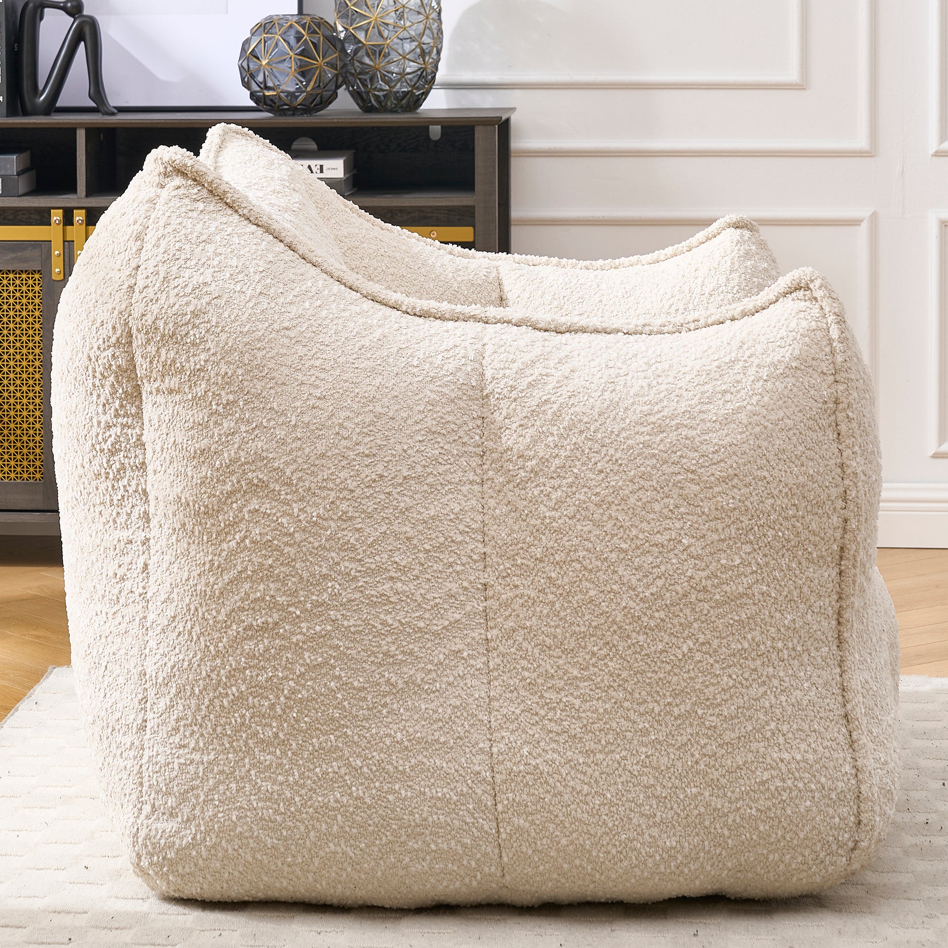 Plush cream boucle fabric bean bag chair offering ultimate comfort and a cozy living room accent