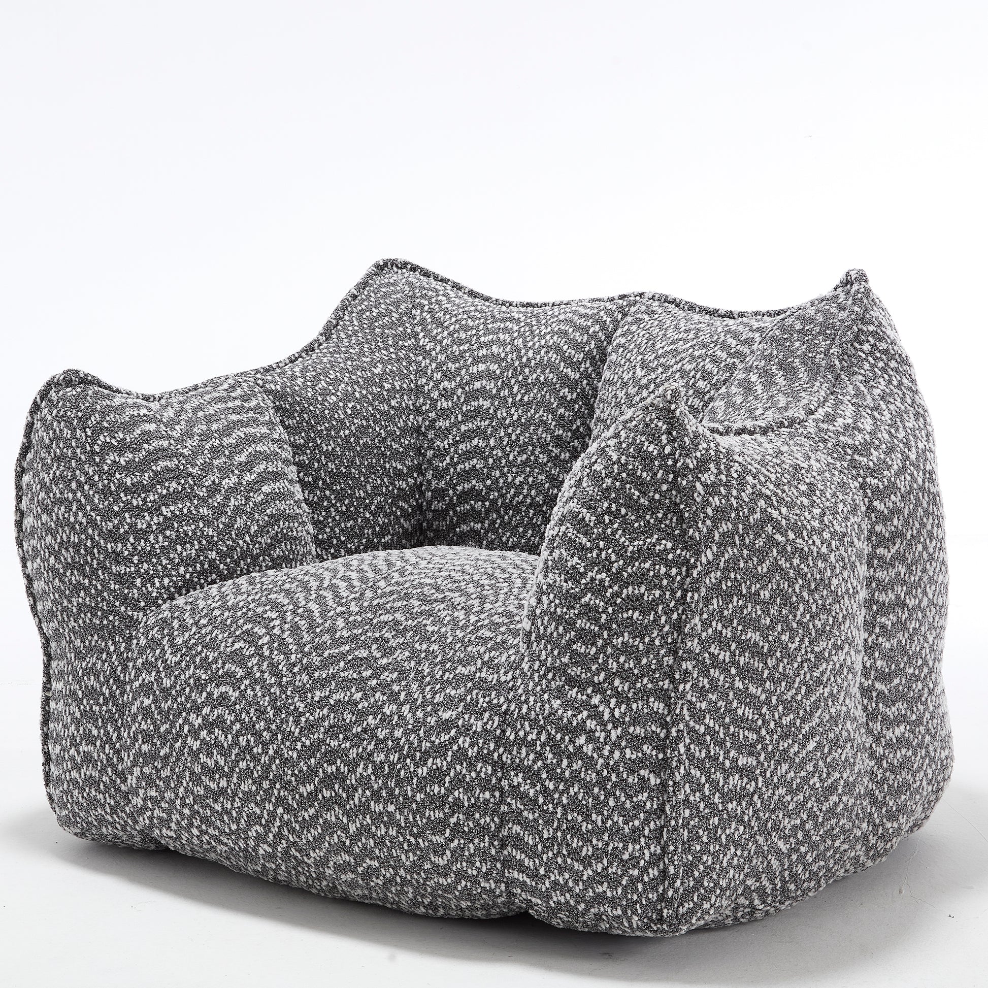 Plush grey and white boucle armchair a cozy accent chair for modern living rooms