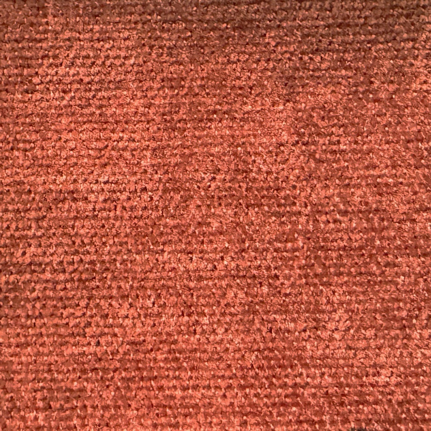 Rich terracotta chenille fabric texture with a soft plush pile for upholstery