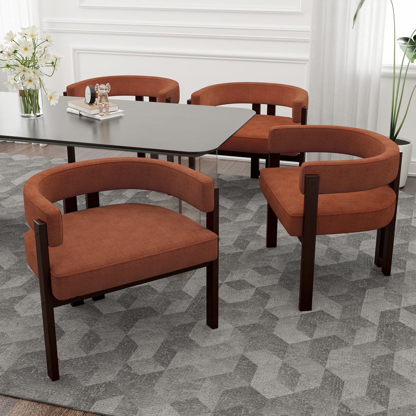 Terracotta upholstered dining chairs with dark wood frames and curved backs