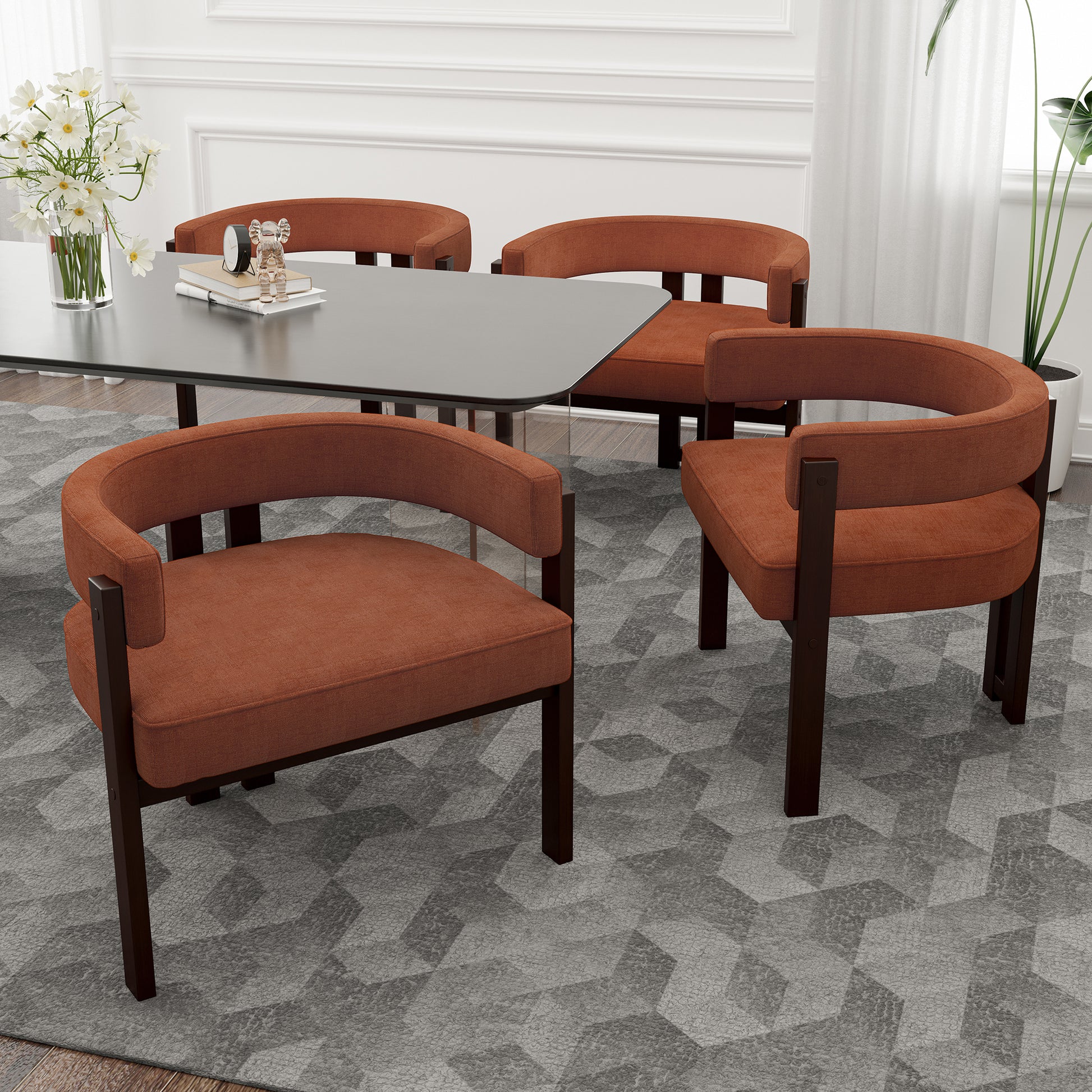 Terracotta upholstered dining chairs with dark wood frames and curved backs